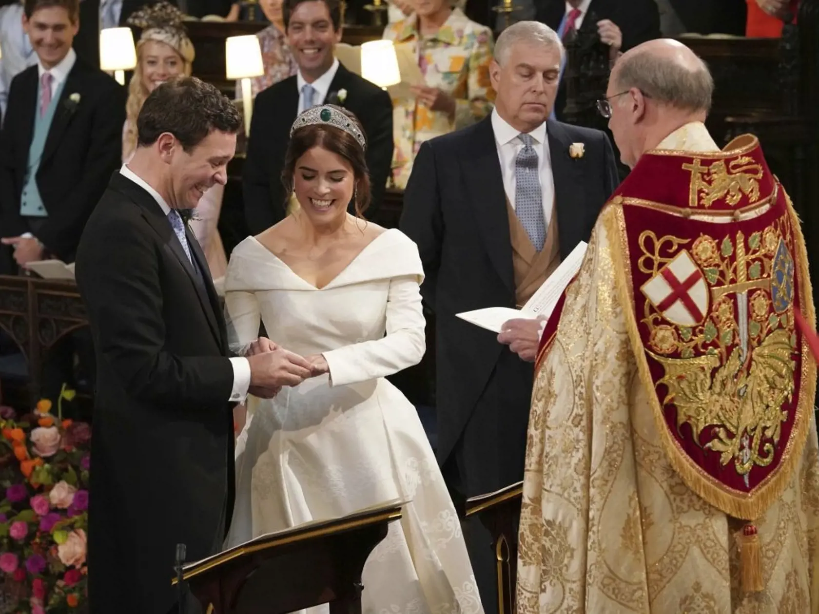 The Rt Revd David Conner, Dean of Windsor conducts the wedding ceremony between Princess Eugenie of York and Jack Brooksbank in St Georgeâs Chapel, Windsor Castle, near London, England, Friday Oct. 12, 2018. (Jonathan Brady, Pool via AP)