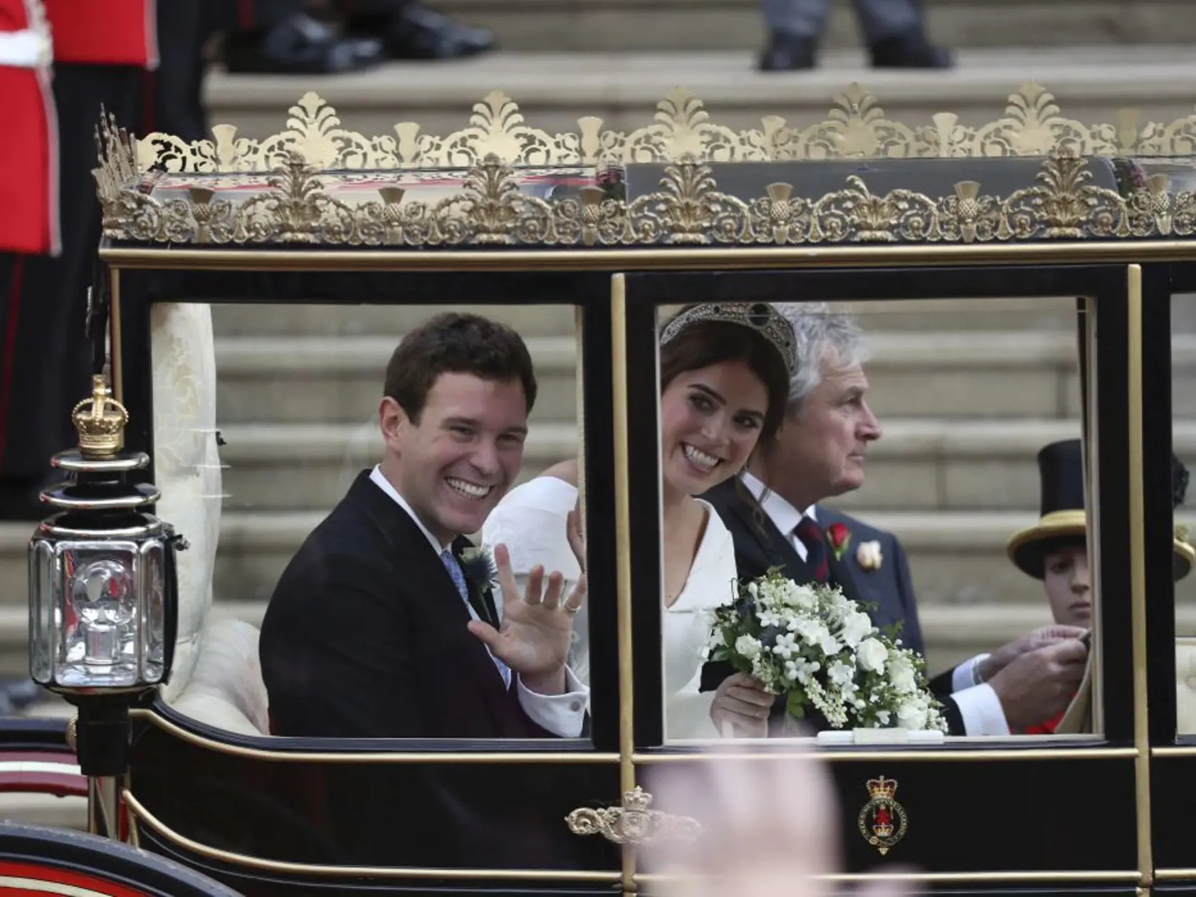Princess Eugenie of York and Jack Brooksbank leave in a carriage after their wedding ceremony at St Georgeâs Chapel, Windsor Castle, near London, England, Friday Oct. 12, 2018.  (Andrew Matthews, Pool via AP)