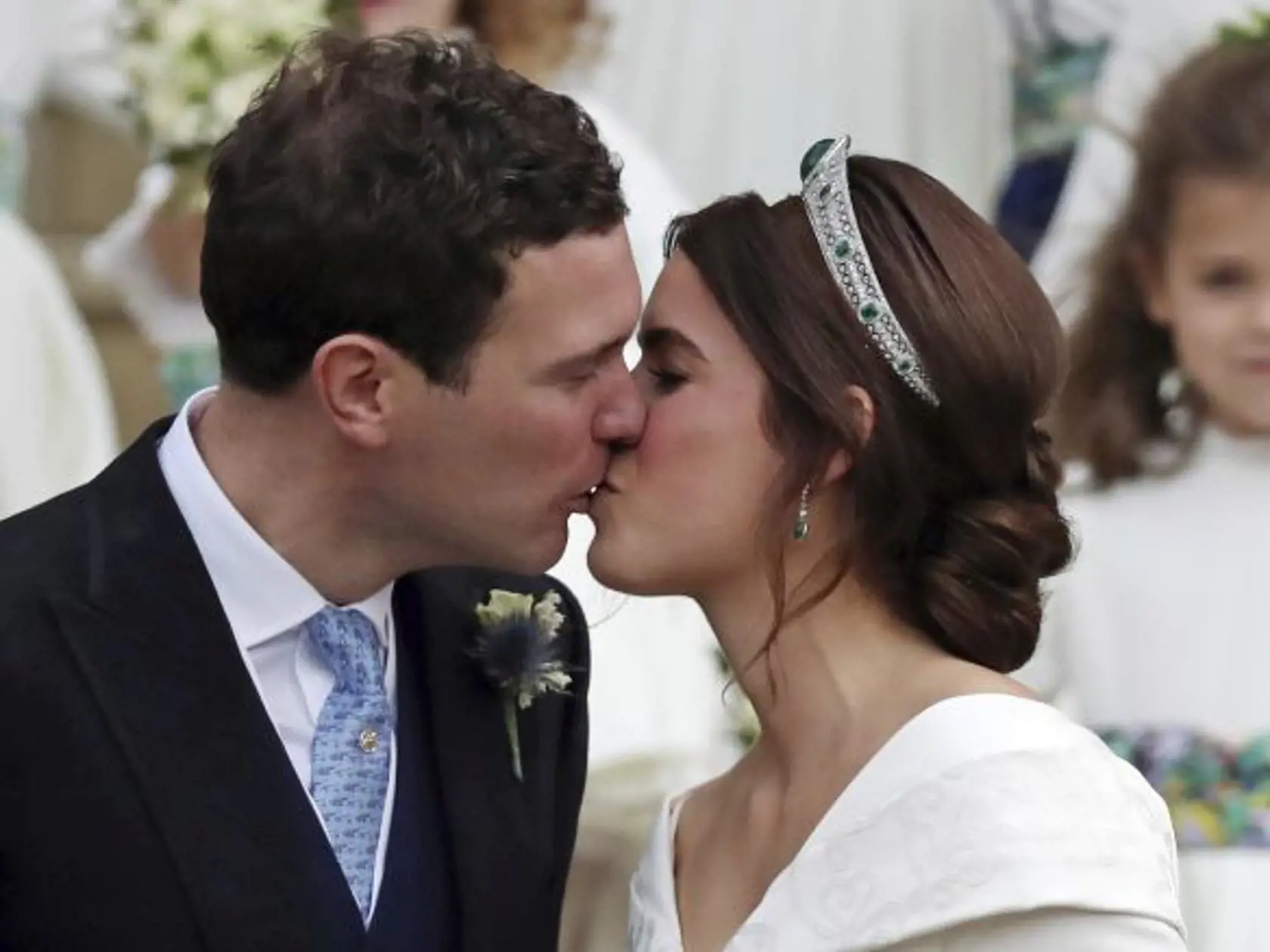 Princess Eugenie and Jack Brooksbank kiss after their wedding on the steps of St George's Chapel, Windsor Castle, near London, England, Friday Oct. 12, 2018. (Steve Parsons, Pool via AP)
