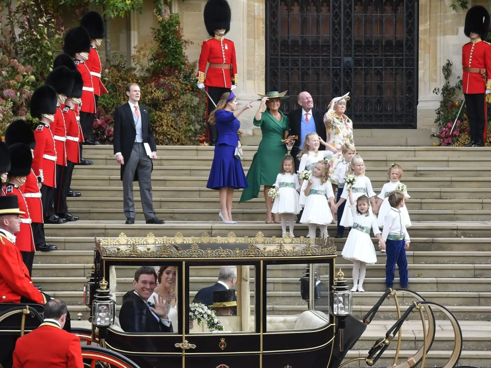 Britain's Princess Eugenie and Jack Brooksbank leave St George's Chapel after their wedding at Windsor Castle, near London, England, Friday Oct. 12, 2018. (Toby Melville, Pool via AP)