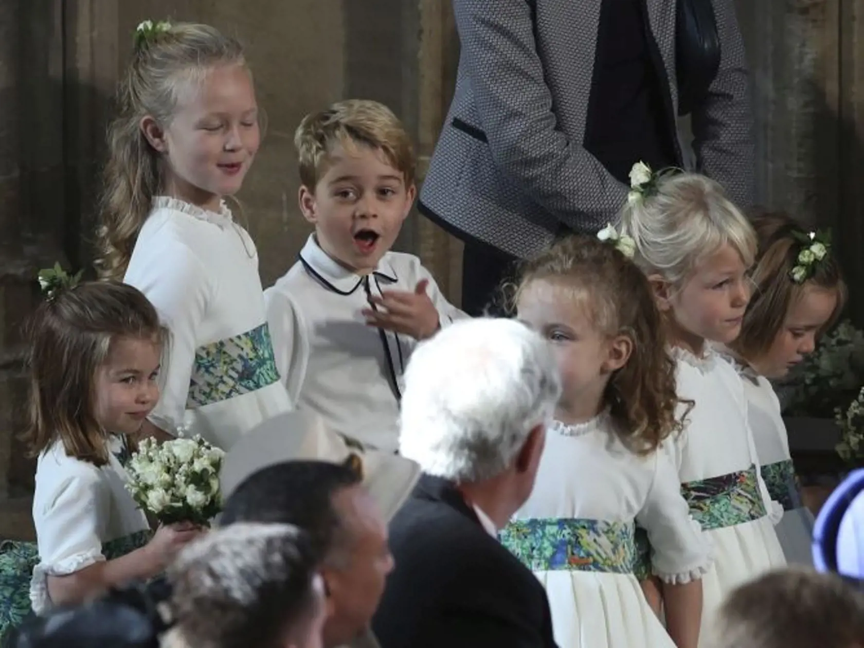 The bridesmaids and page boys, including Prince George and Princess Charlotte, arrive for the wedding of Princess Eugenie of York and Jack Brooksbank in St Georgeâs Chapel, Windsor Castle, near London, England, Friday Oct. 12, 2018. (Yui Mok, Pool via AP)