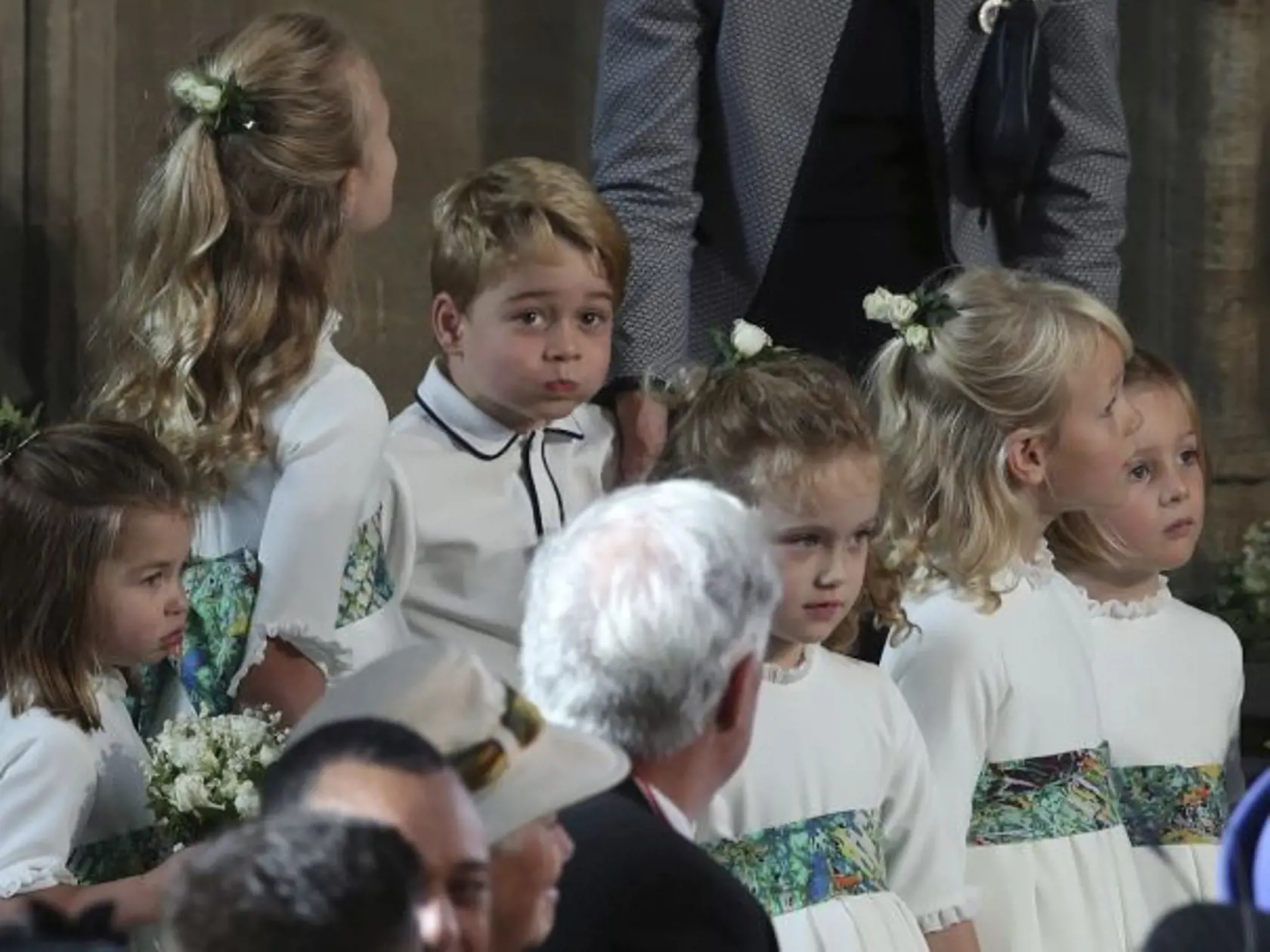The bridesmaids and page boys, including Prince George and Princess Charlotte, arrive for the wedding of Princess Eugenie of York and Jack Brooksbank in St Georgeâs Chapel, Windsor Castle, near London, England, Friday Oct. 12, 2018. (Yui Mok, Pool via AP)