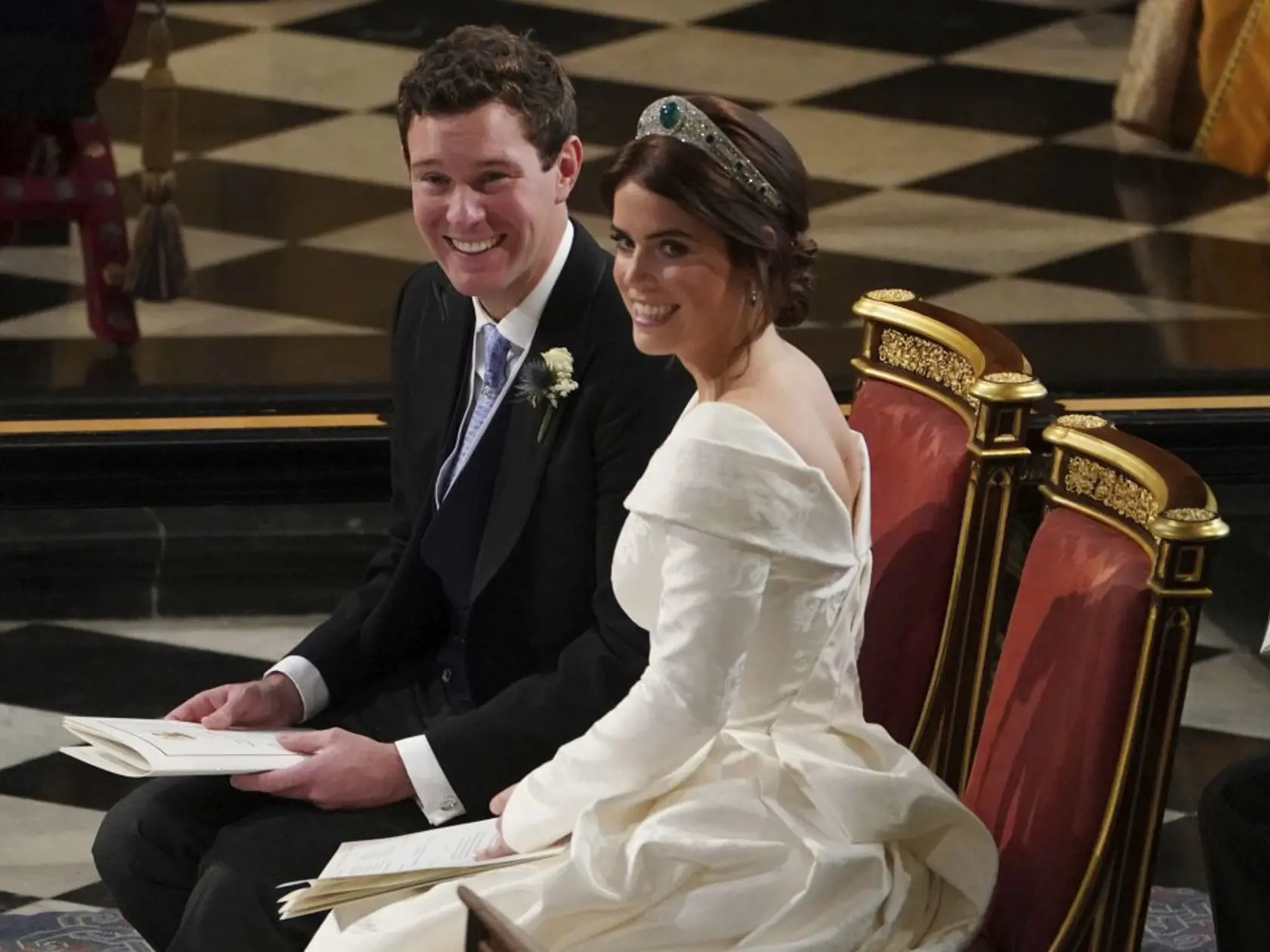 Princess Eugenie of York and Jack Brooksbank smile during their wedding in St Georgeâs Chapel, Windsor Castle, near London, England, Friday Oct. 12, 2018. (Owen Humphreys, Pool via AP)