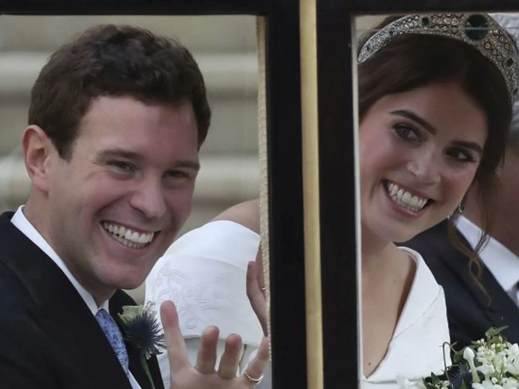 Princess Eugenie of York and Jack Brooksbank leave in a carriage after their wedding ceremony at St George's Chapel, Windsor Castle, near London, England, Friday Oct. 12, 2018. (Andrew Matthews, Pool via AP)