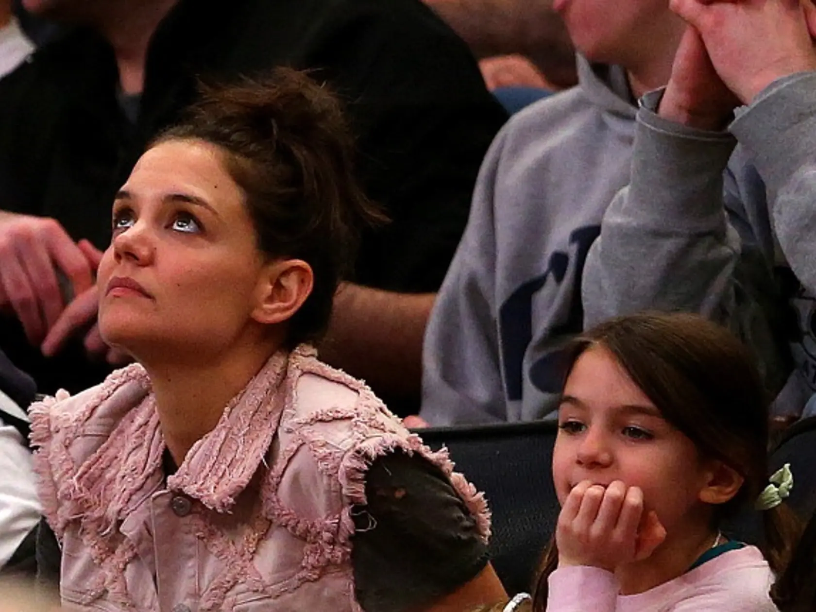 NEW YORK, NY - MARCH 30:  Actress Katie Holmes and her daughter Suri Cruise attend the East Regional Final of the 2014 NCAA Men's Basketball Tournament between the Connecticut Huskies and the Michigan State Spartans at Madison Square Garden on March 30, 2014 in New York City.  (Photo by Elsa/Getty Images)