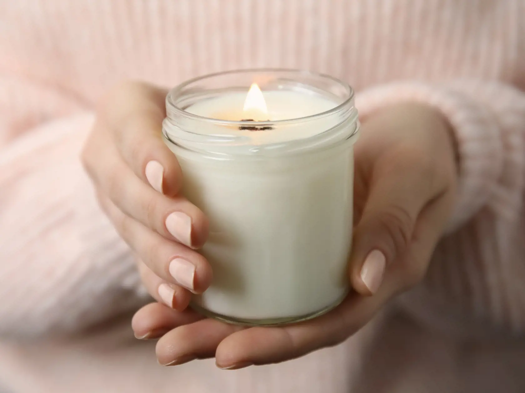Woman,Holding,Burning,Candle,With,Wooden,Wick,,Closeup
