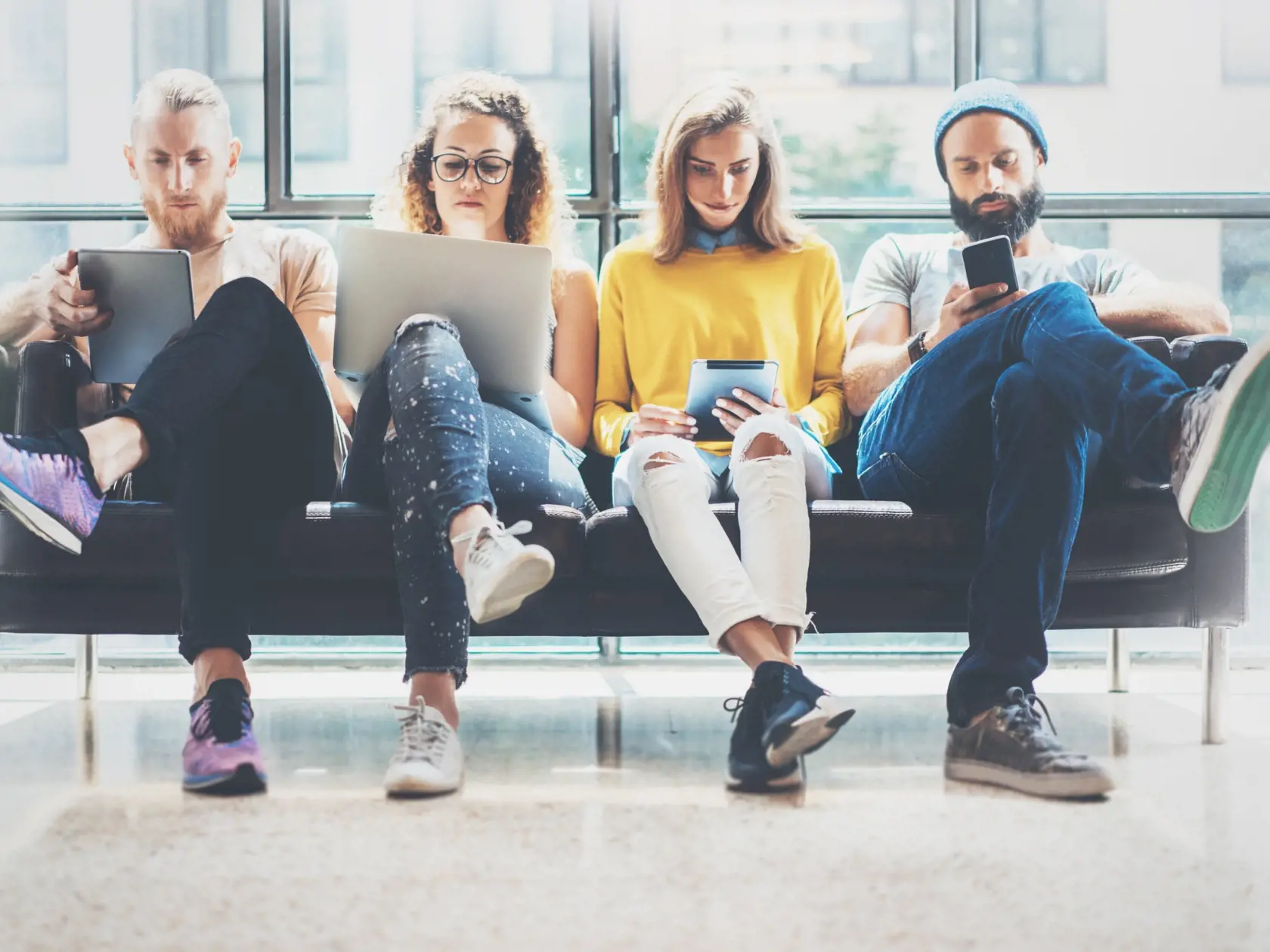 Group,Adult,Hipsters,Friends,Sitting,Sofa,Using,Modern,Gadgets.business,Startup