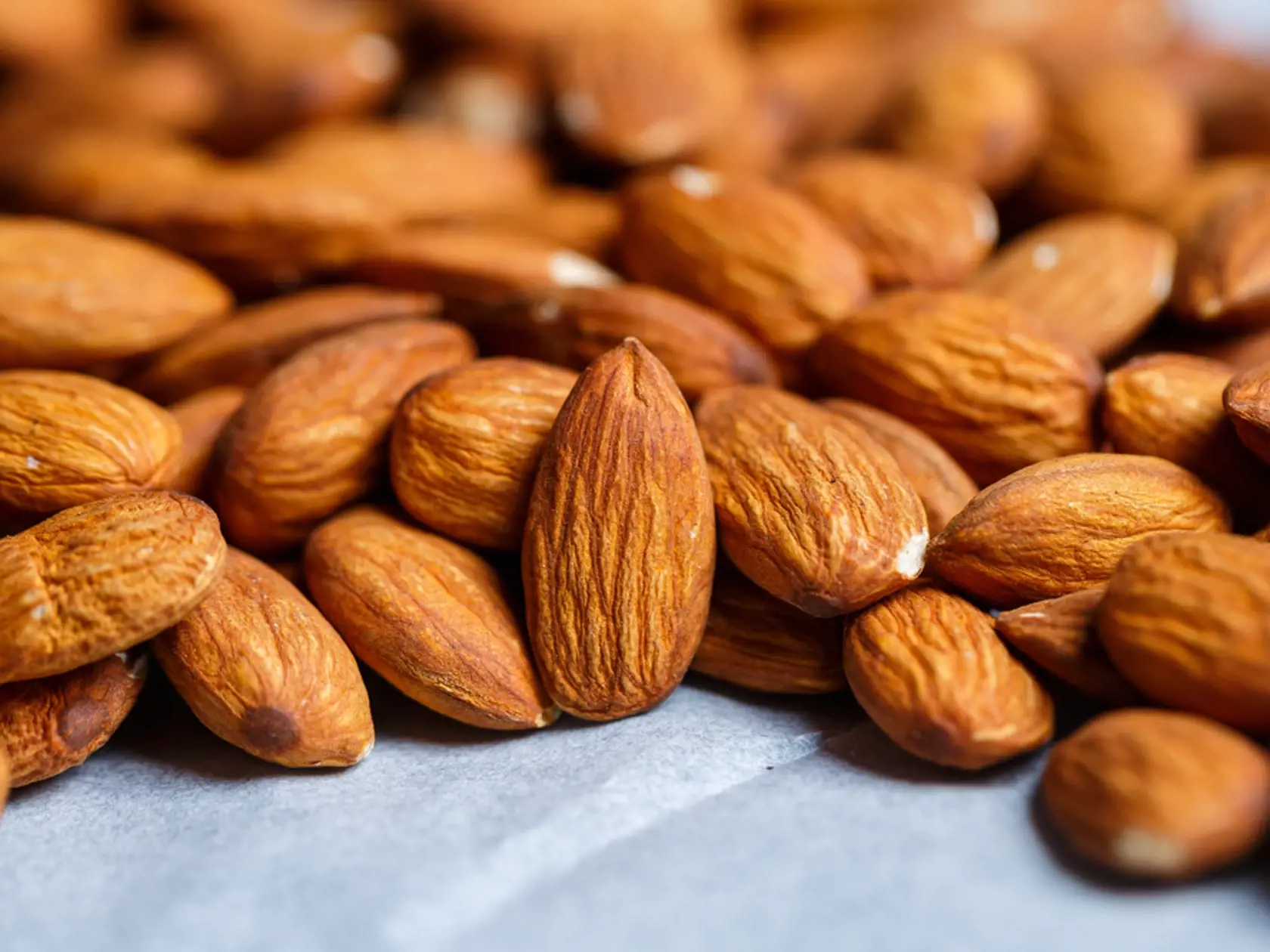 Delicious,Roasted,Sweet,Almonds,Lie,In,A,Large,Heap,,Nuts