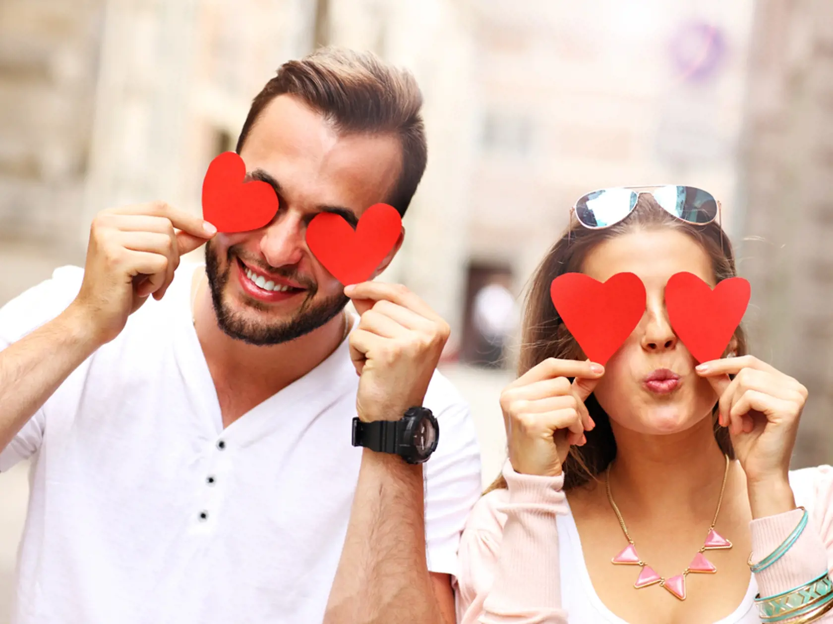 A,Picture,Of,A,Happy,Couple,Covering,Eyes,With,Hearts