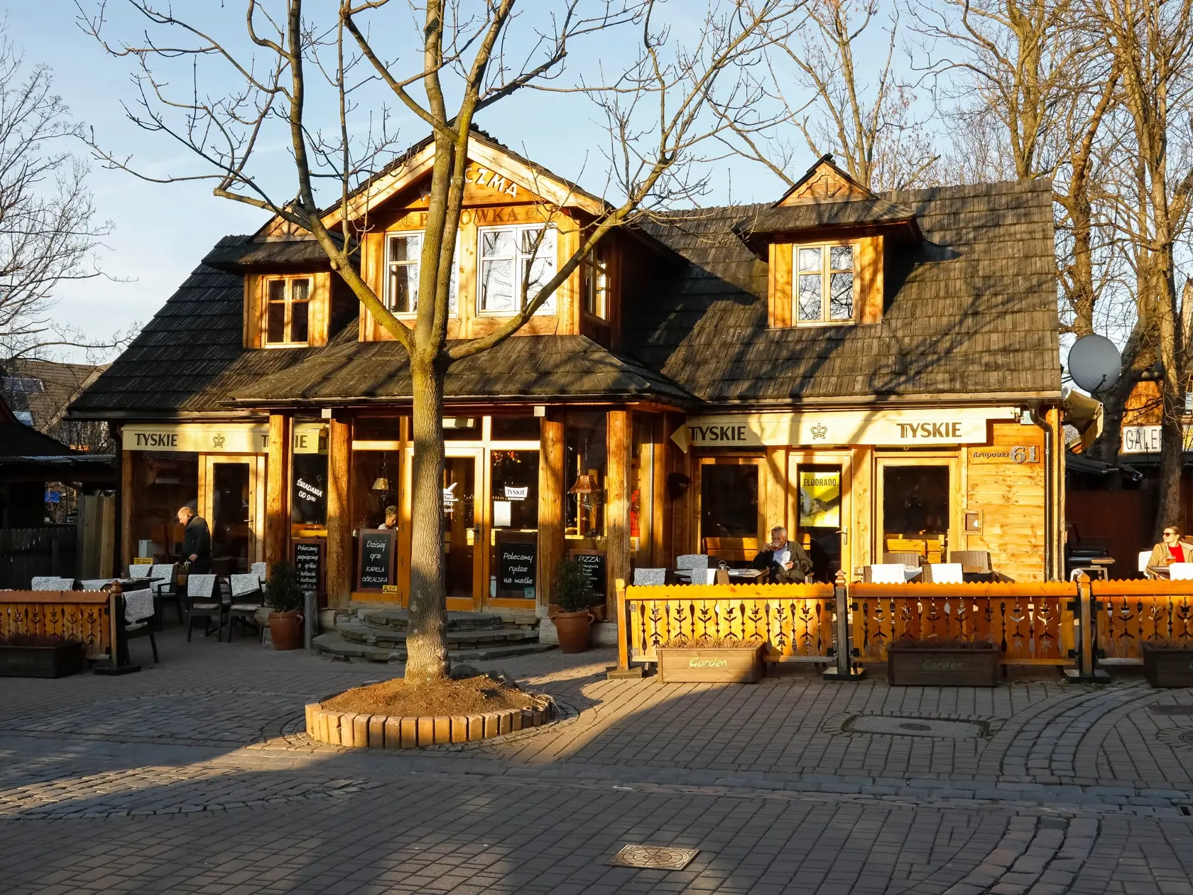 Zakopane,,Poland,-,November,08,,2018:,A,Wooden,Building,Illuminated