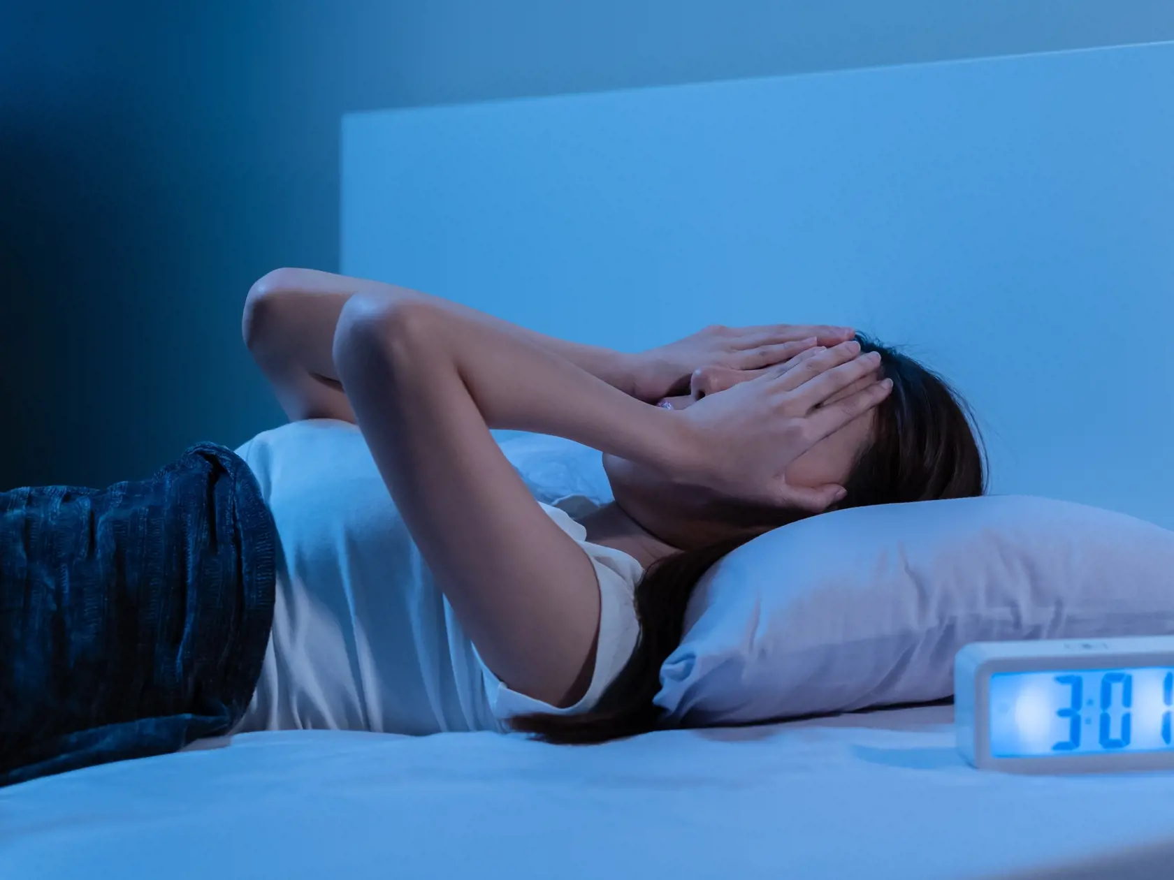 Annoyed, Stressed, asian young beautiful, pretty woman, girl suffering from insomnia, awake in bed at night, covering face with hand because of disturbed loud noise, unable sleep. Restless people.