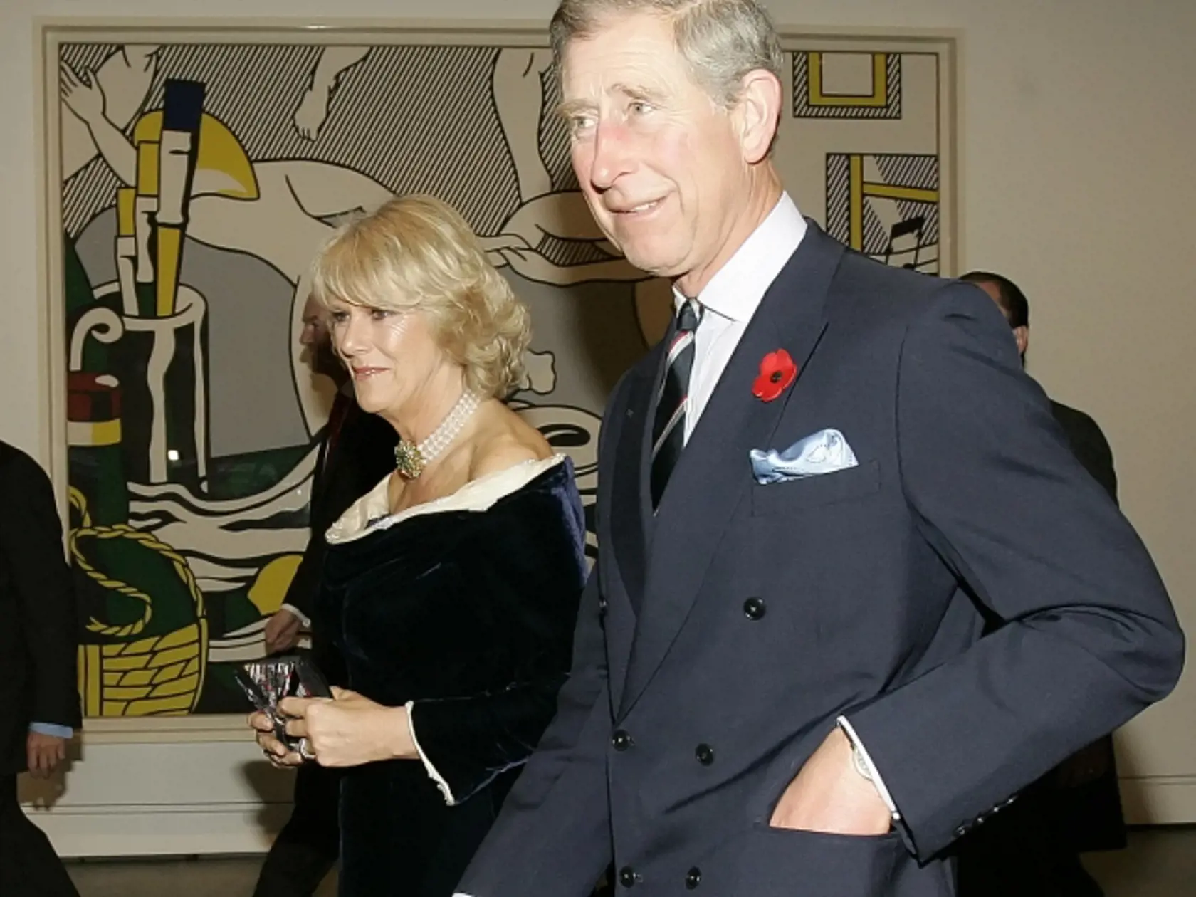 Britain's Prince Charles and Camilla, Duchess of Cornwall pass a painting by Roy Lichtenstein at the Modern Art Museum in New York Tuesday, Nov. 1, 2005.  (AP Photo/Gregory Bull)