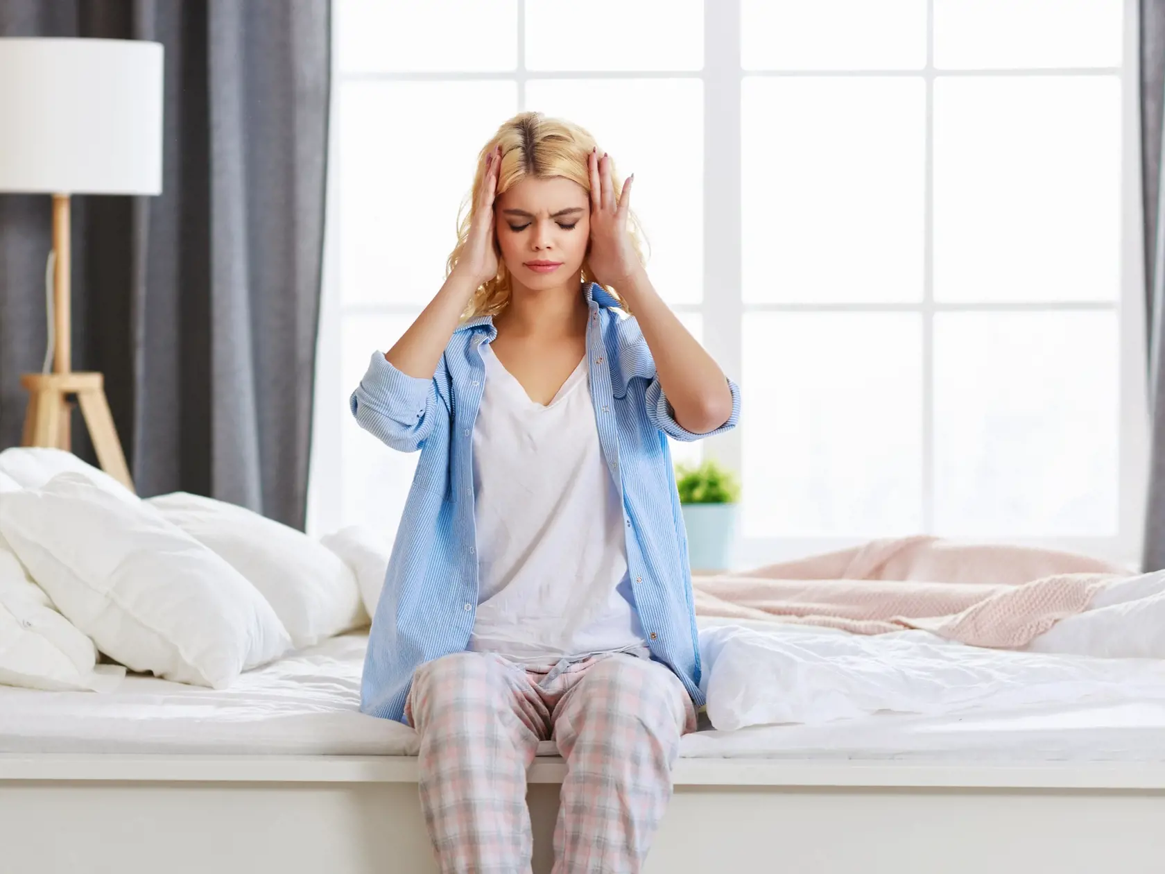 Young,Woman,With,A,Headache,,Was,Sick,In,Bed,In