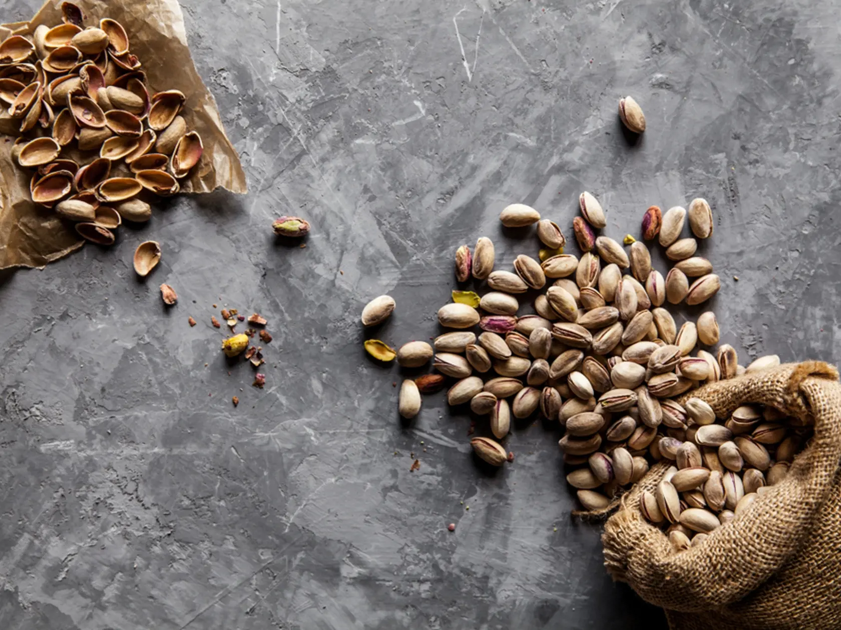 Roasted pistachios on natural wooden table background a; Shutterstock ID 1156652215; job: Job (TFH, TOH, RD, BNB, CWM, CM)