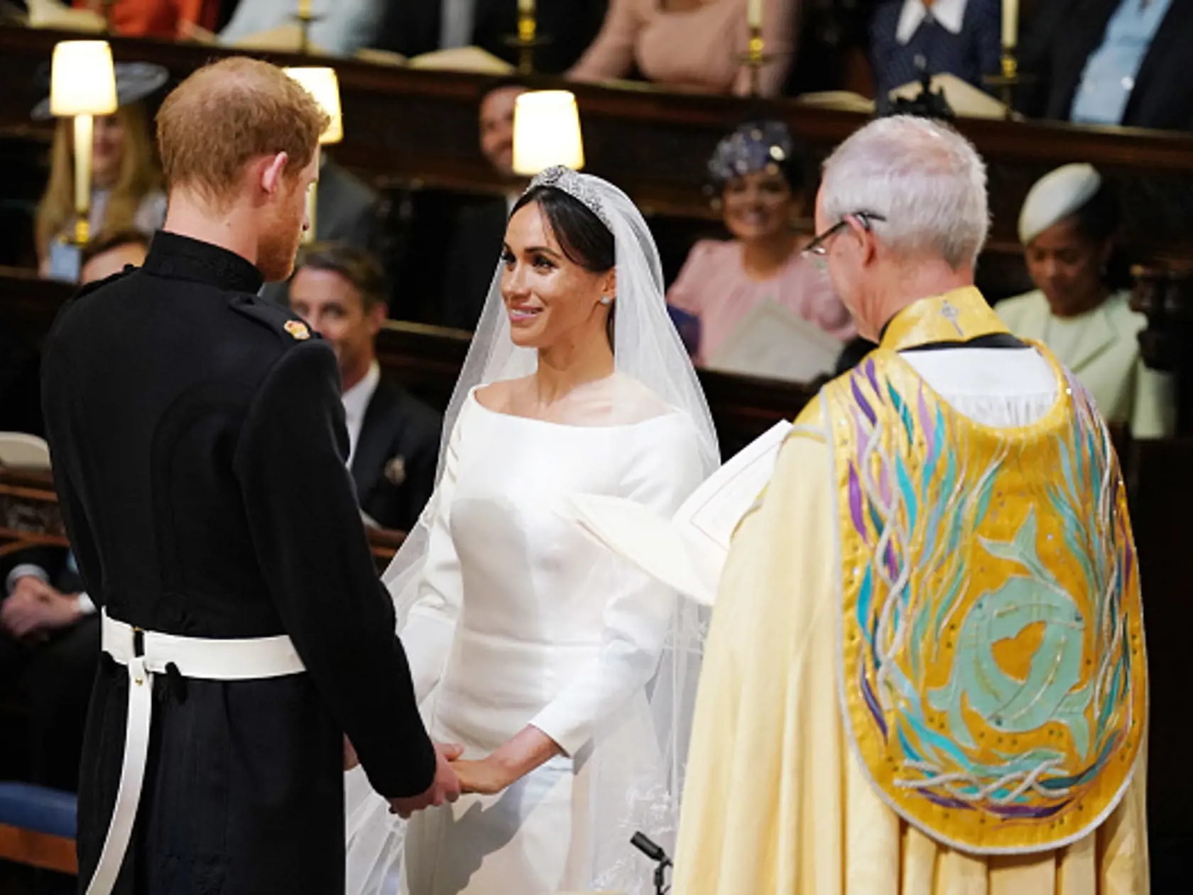 WINDSOR, UNITED KINGDOM - MAY 19:  Prince Harry and Meghan Markle during their wedding service, conducted by the Archbishop of Canterbury Justin Welby in St George's Chapel at Windsor Castle on May 19, 2018 in Windsor, England. (Photo by Dominic Lipinski - WPA Pool/Getty Images)