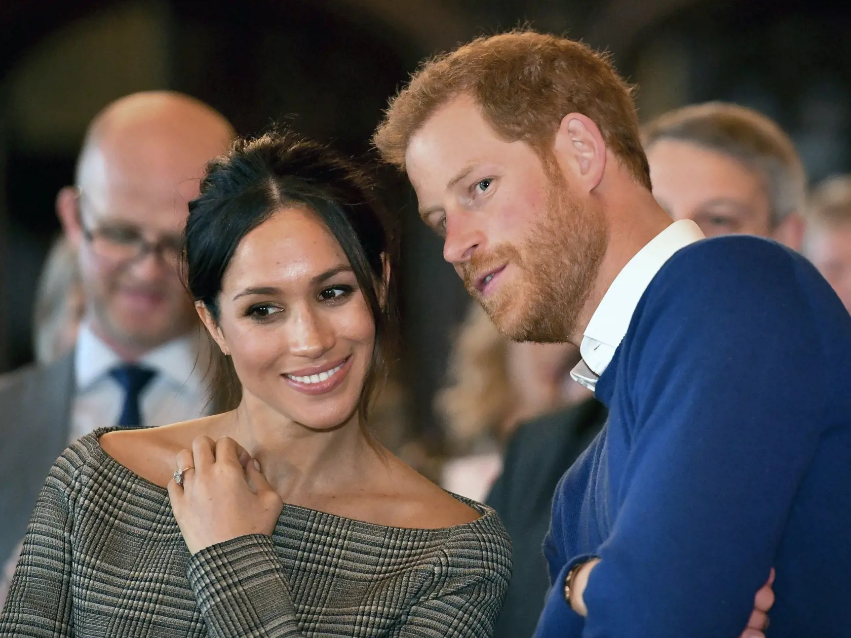 Britain's Prince Harry talks to Meghan Markle as they watch a dance performance by Jukebox Collective in the banqueting hall during a visit to Cardiff Castle, Wales, Thursday Jan. 18, 2018. Meghan and Prince Harry are visiting the area. (Ben Birchall/Pool via AP)