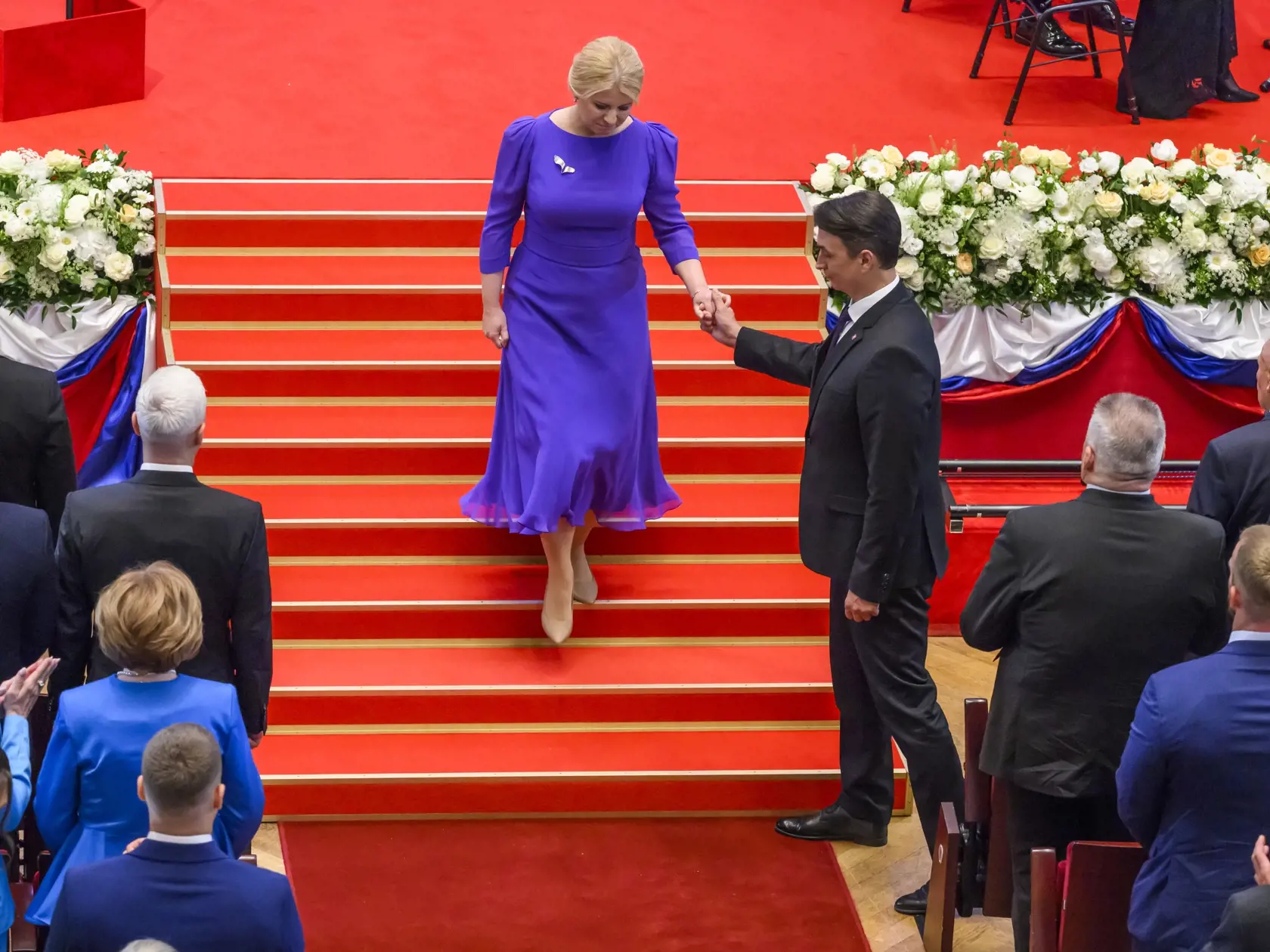 Na snímke bývalá prezidentka SR Zuzana Čaputová odchádza na záver slávnostnej schôdze Národnej rady SR pri príležitosti zloženia sľubu prezidenta SR Petra Pellegriniho v priestoroch budovy Slovenskej filharmónie 15. júna 2024 v Bratislave. Vpravo jej partner Juraj Rizman. FOTO TASR - Jaroslav Novák