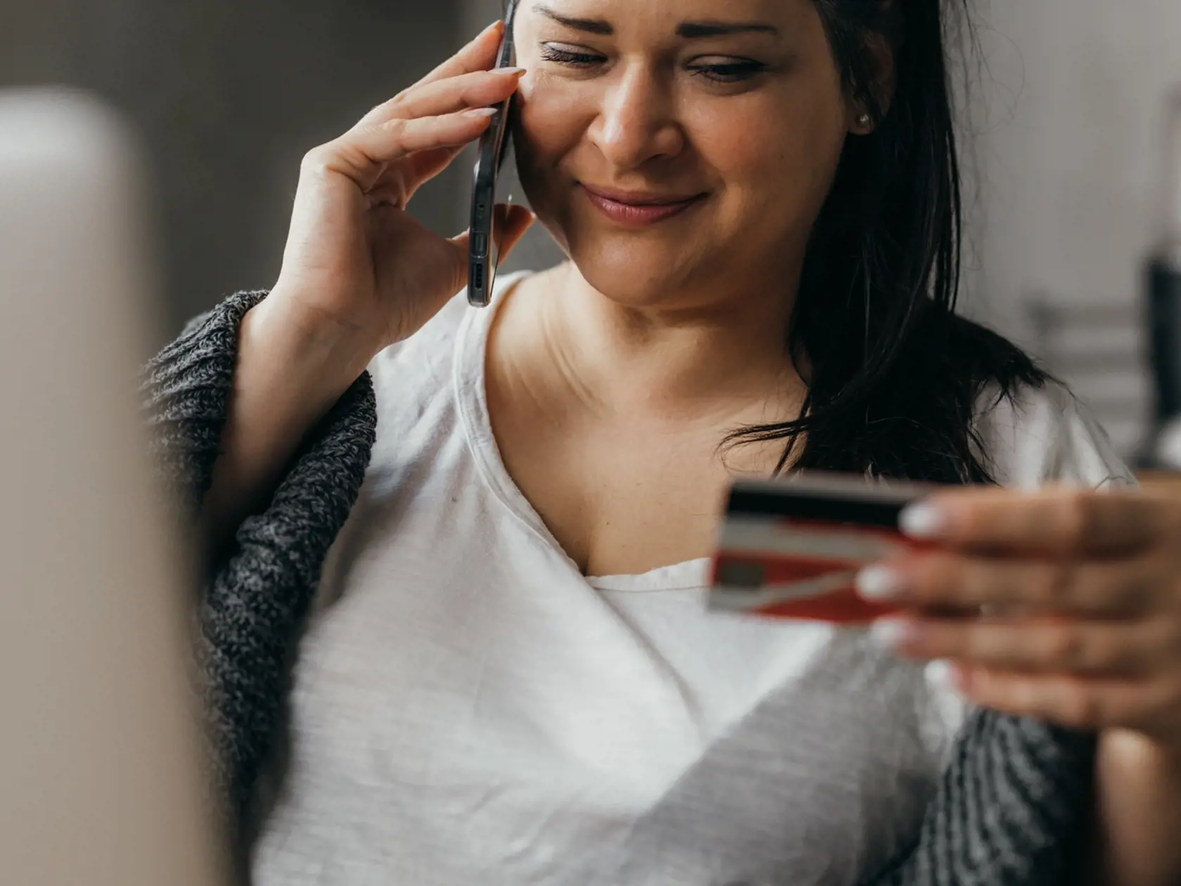 Woman,Shops,Online,And,Talks,On,The,Phone