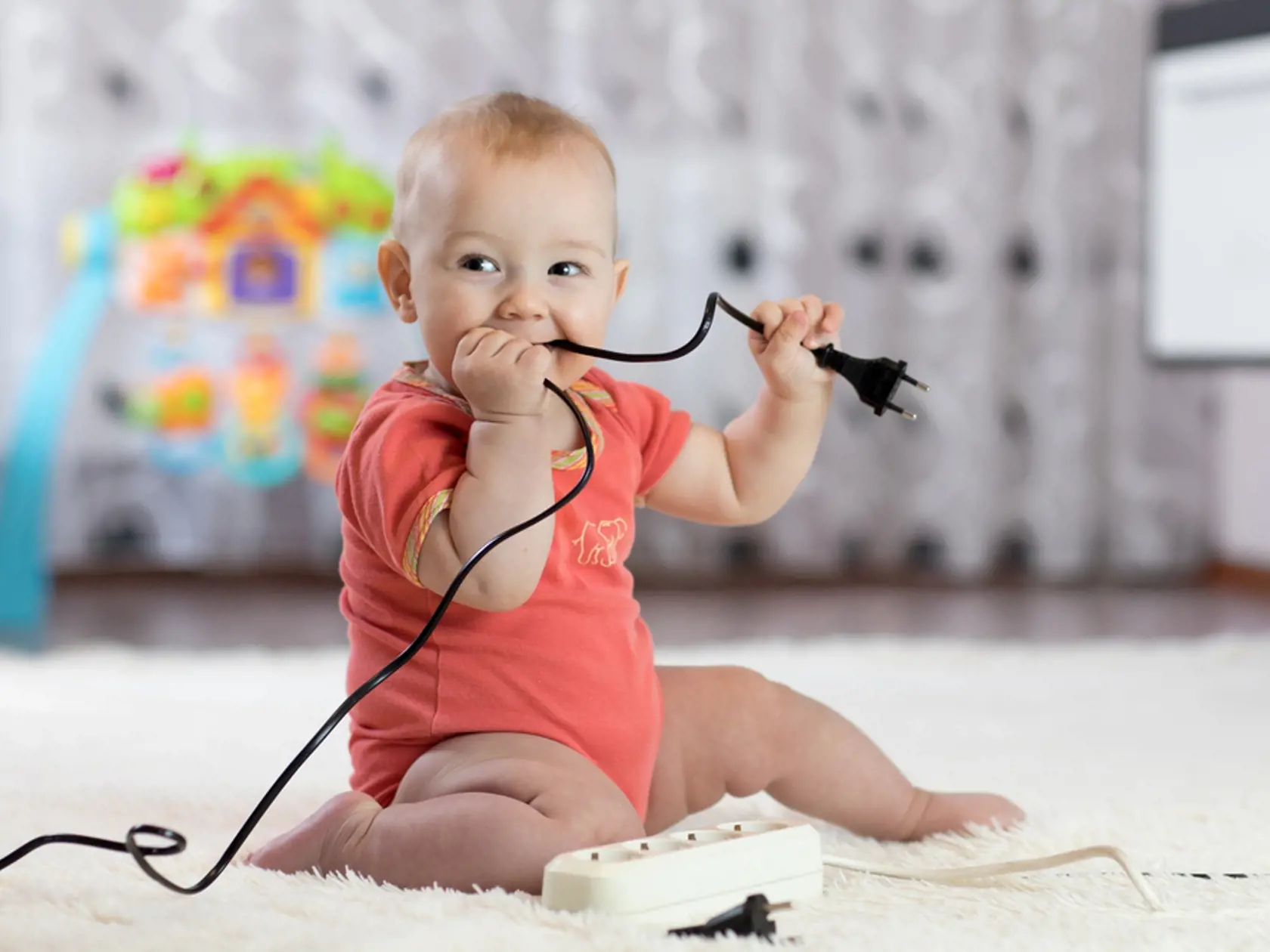 8,Months,Age,Baby,Curious,Looking,With,Electronic,Plug.