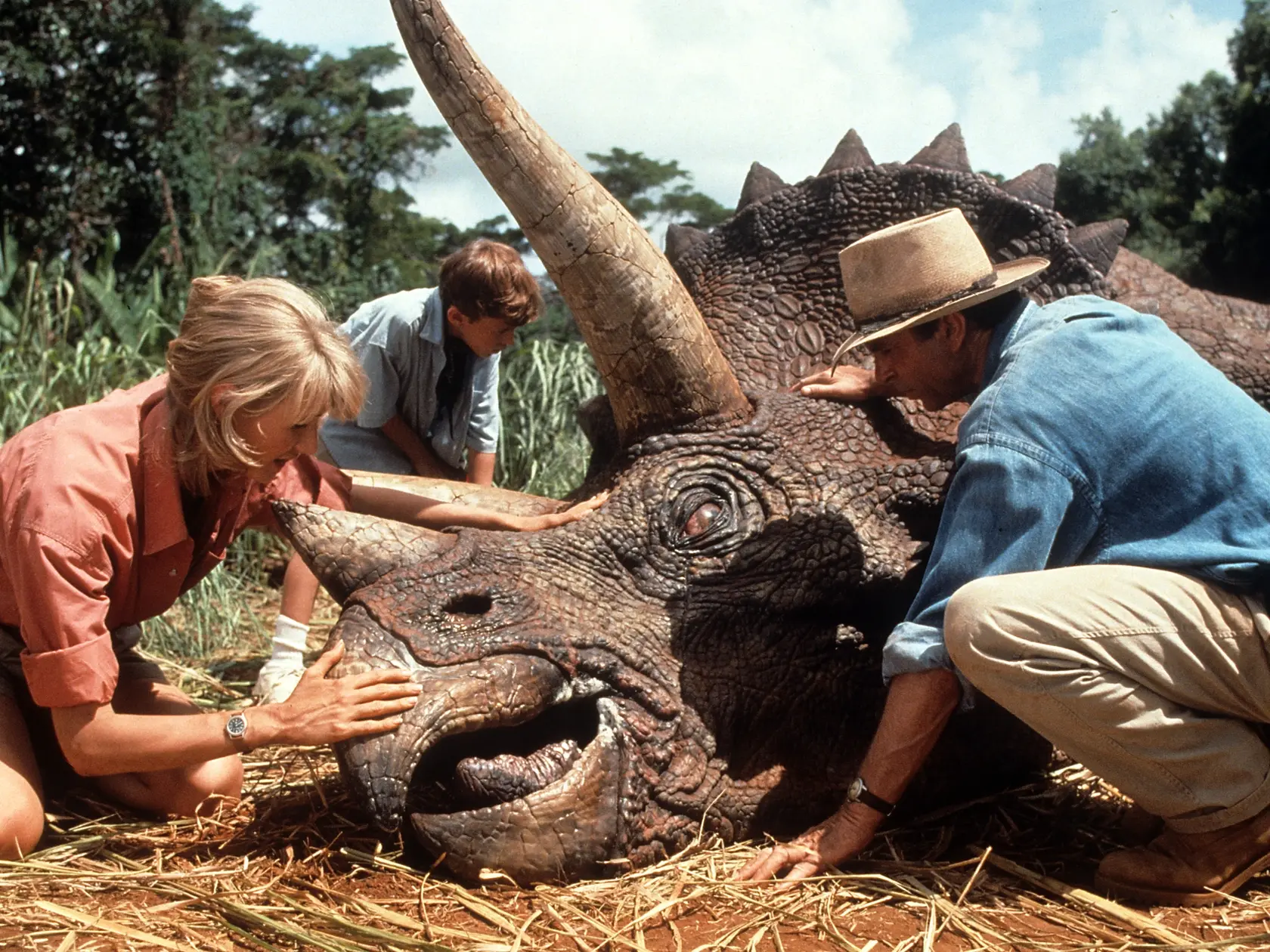 Laura Dern and Sam Neill come to the aid of a triceratops in a scene from the film 'Jurassic Park', 1993. (Photo by Universal/Getty Images)