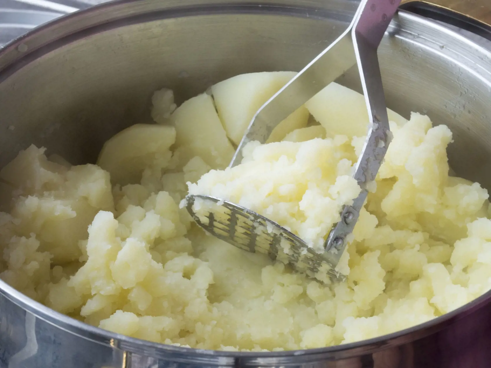 Close up image of a silver pan of mashed potato