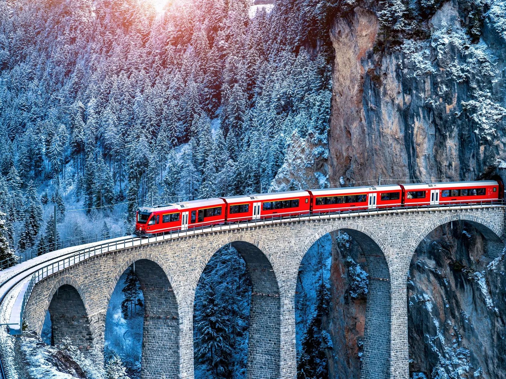 Aerial,View,Of,Train,Passing,Through,Famous,Mountain,In,Filisur,