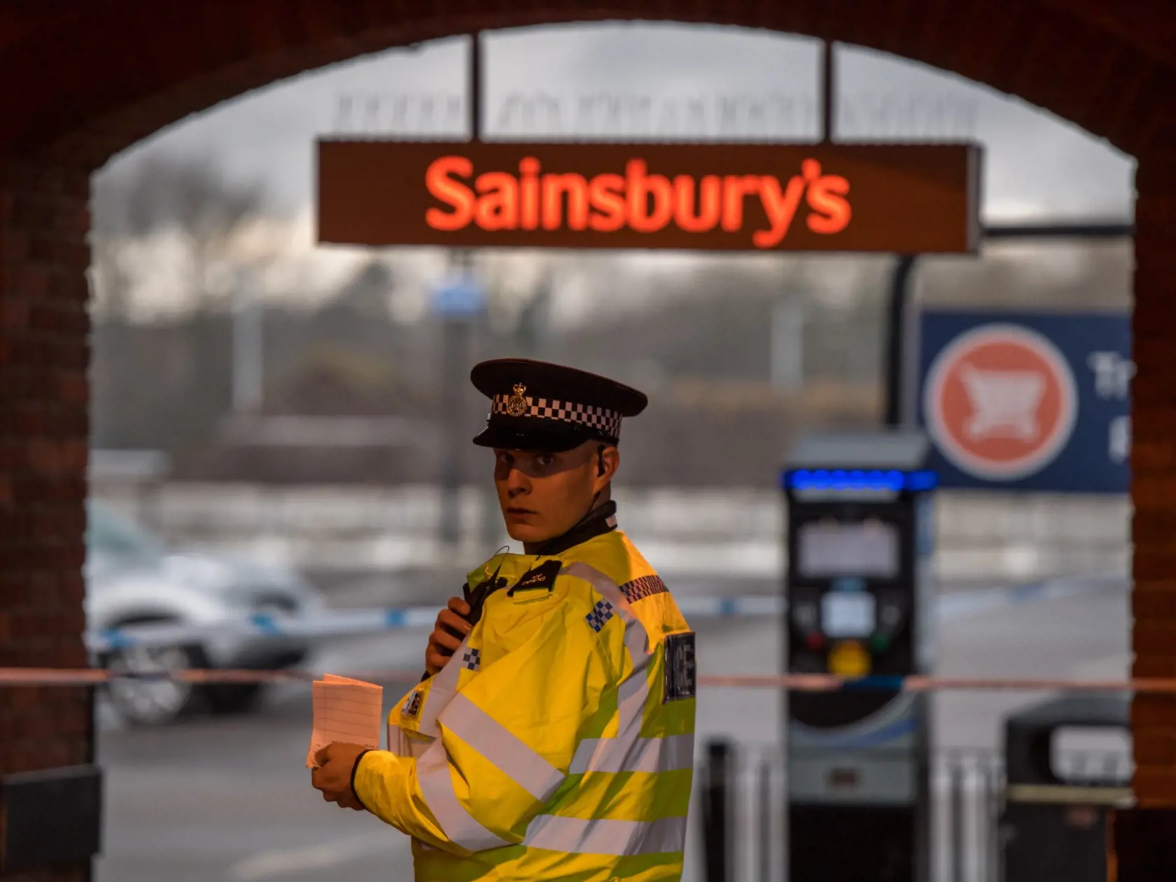 SALISBURY, ENGLAND - MARCH 12:  Police cordon off the upper level of a Sainsbury's supermarket car park, opposite the park bench where Sergei Skripal was found, as investigations continue into the poisoning of Sergei Skripal on March 12, 2018 in Salisbury, England. Sergei Skripal who was granted refuge in the UK following a 'spy swap' between the US and Russia in 2010 and his daughter remain critically ill after being attacked with a nerve agent.  (Photo by Chris J Ratcliffe/Getty Images)
