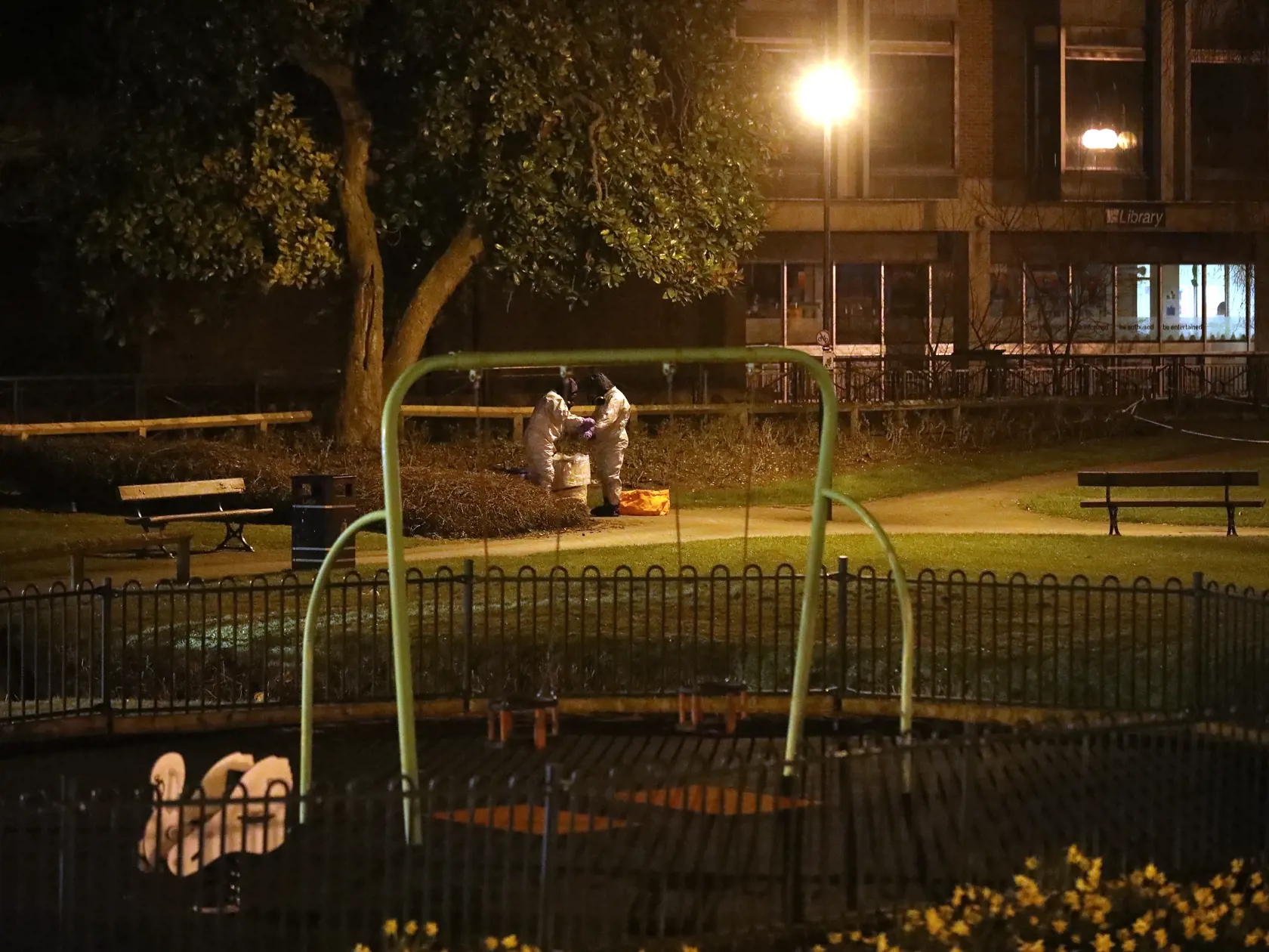 SALISBURY, ENGLAND - MARCH 13:  Police officers in forensics suits and protective masks work next to a children's park at the scene of the poisoning of Sergei Skripal on March 13, 2018 in Salisbury, England. British Prime Minister Theresa May has given the Russian government a deadline of midnight tonight to explain why a nerve agent of Russian origin was used in the poisoning of former Russian agent Sergei Skripal and his daughter. Mr Skripal who was granted refuge in the UK following a 'spy swap' between the US and Russia in 2010 and his daughter remain critically ill after being attacked with a nerve agent.  (Photo by Christopher Furlong/Getty Images)