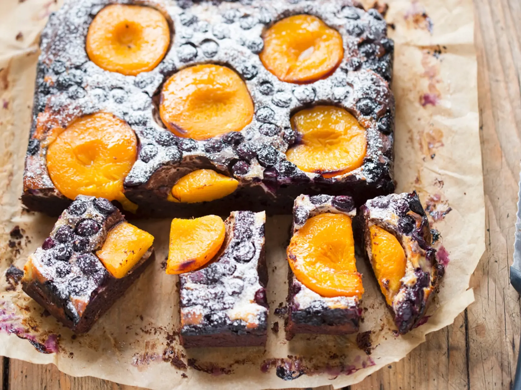 Blueberry,Apricot,Brownie,Cheesecake,With,Icing,Sugar