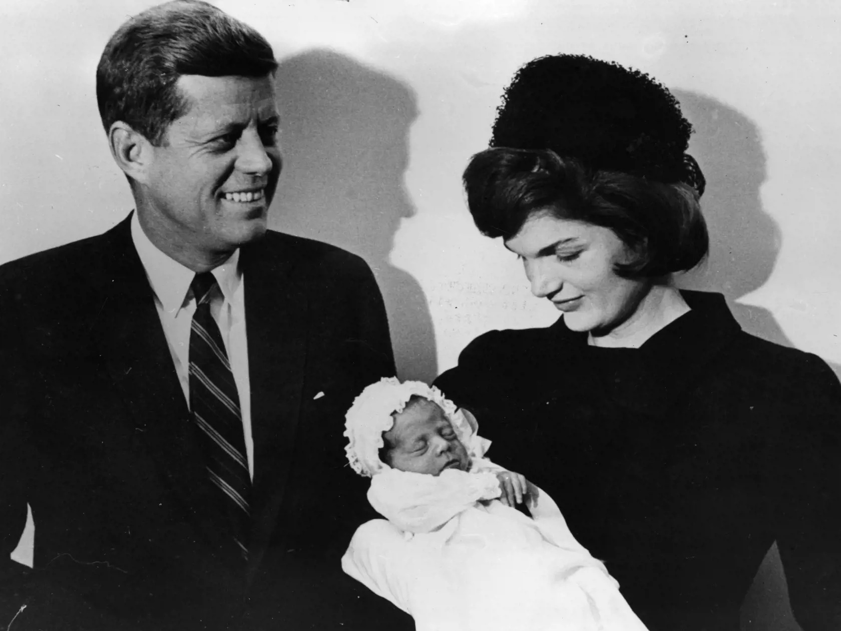 John F Kennedy (1917 - 1963), American president-elect, with his wife Jacqueline (1929 - 1994) at the christening of their son John F Jr. (1960 - 1999) in Washington.    (Photo by Keystone/Getty Images)