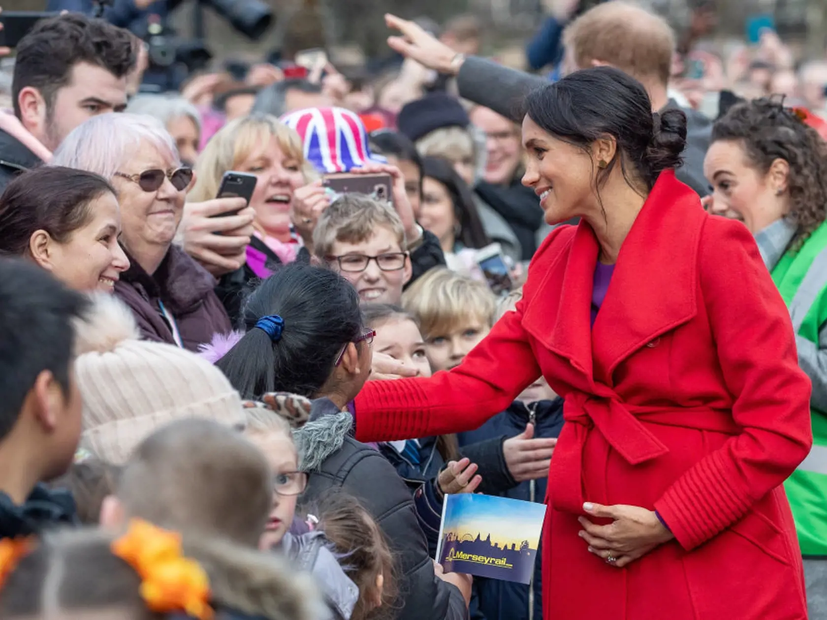 BIRKENHEAD, UNITED KINGDOM - JANUARY 14: Meghan, Duchess of Sussex greet well-wishers on Hamilton Square as they visit a new statue to mark the 100th anniversary of the death of poet Wilfred Owen, which was erected on Hamilton Square in November, during an official visit to Birkenhead on January 14, 2019 in Birkenhead, United Kingdom. (Photo by Charlotte Graham - WPA Pool/Getty Images)