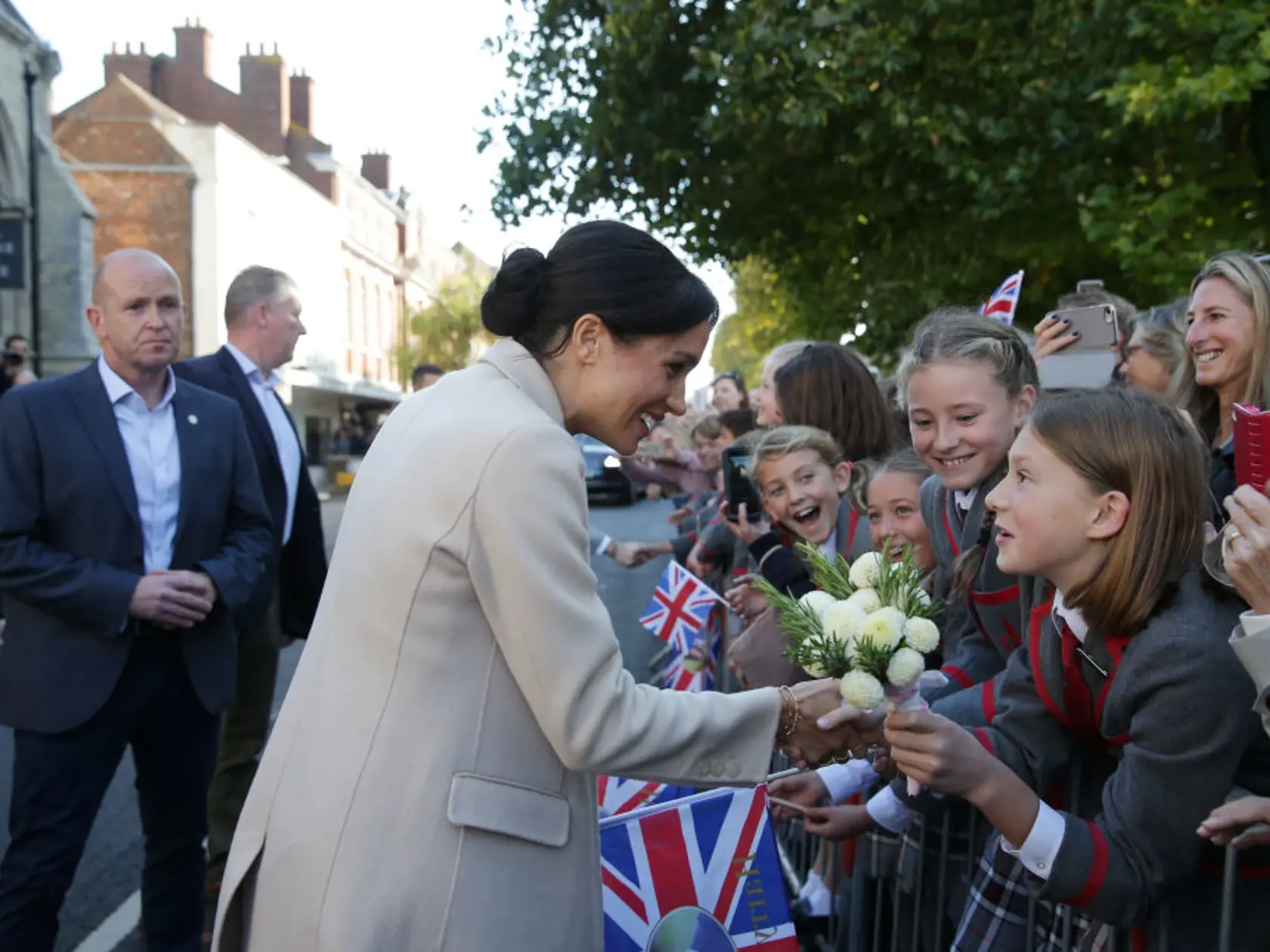 CHICHESTER, ENGLAND - OCTOBER 3: Meghan, Duchess of Sussex greets well-wishers as she arrives for an engagement at Edes House during an official visit to Sussex on October 3, 2018 in Chichester, England. The Duke and Duchess married on May 19th 2018 in Windsor and were conferred The Duke & Duchess of Sussex by The Queen.  (Photo by Daniel Leal-Olivas - WPA Pool/Getty Images)