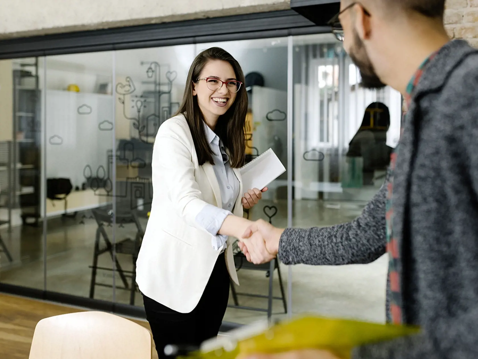 Openly greeting a job recruiter with a firm handshake
