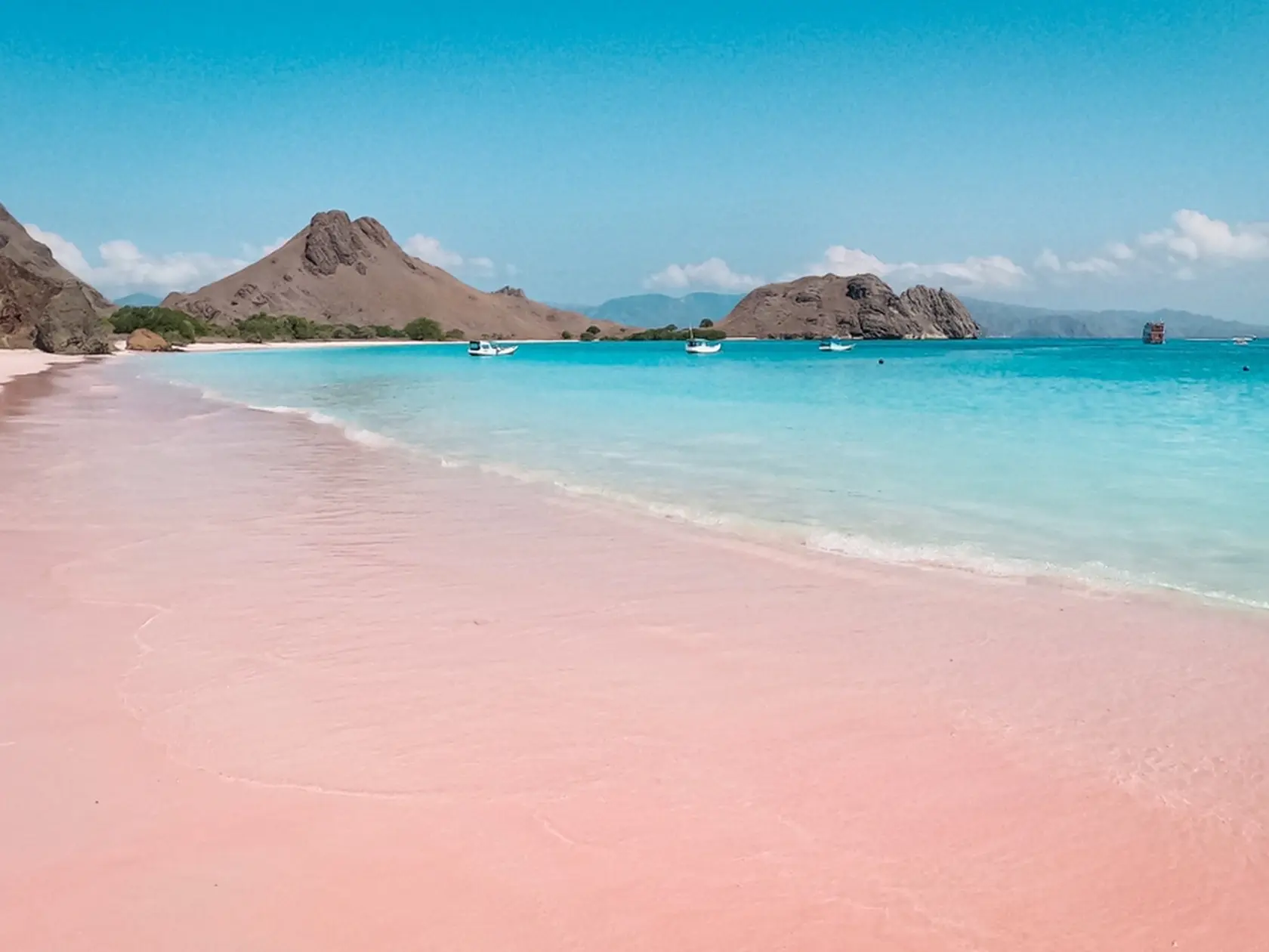 An Exotic Pink Beach (Long Beach) and blue clear water in Padar Island, Labuan Bajo, has become a favorite visiting place for domestic and foreign tourists
