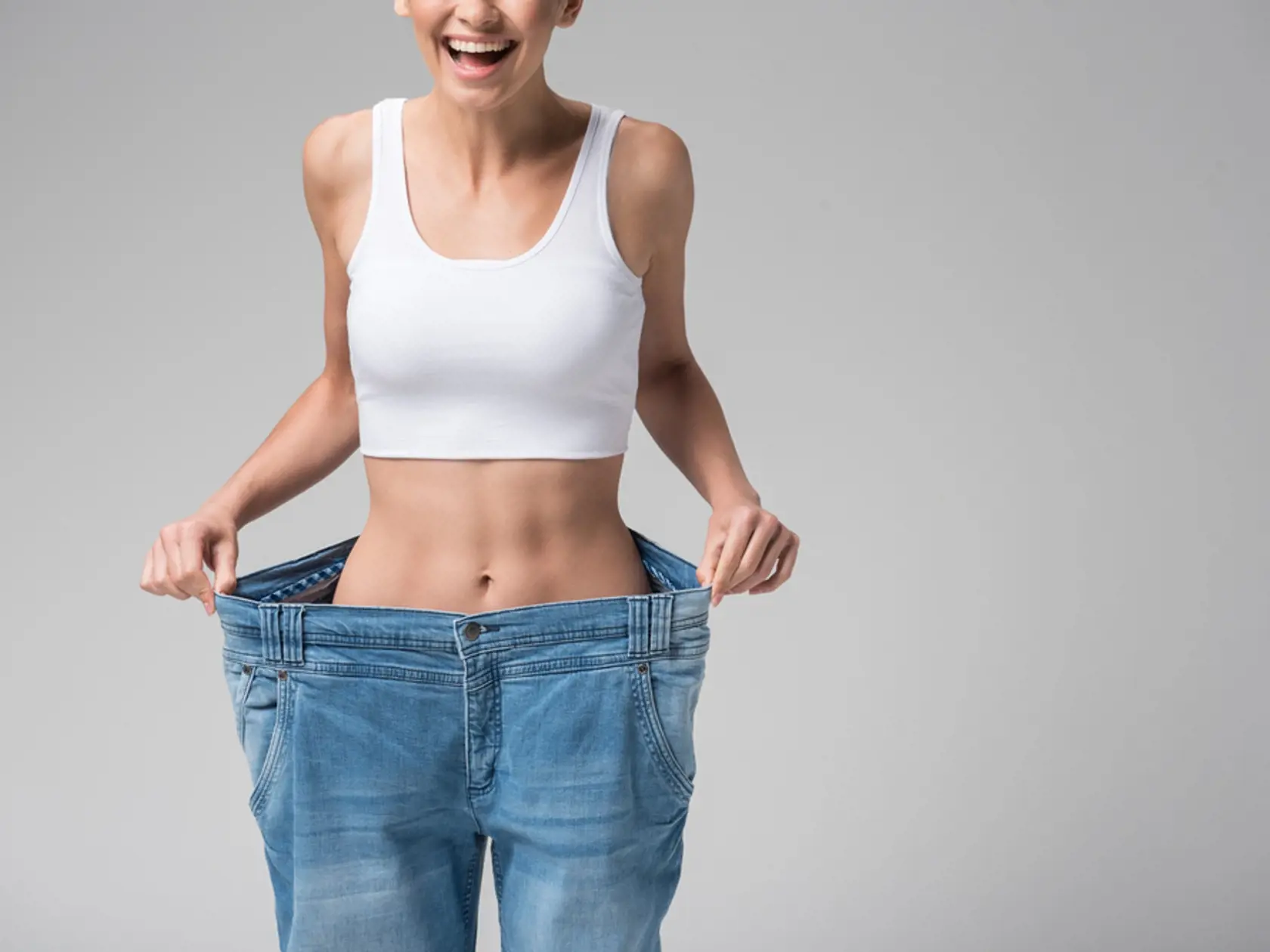 Happy,Girl,Showing,Her,Slim,Figure,After,Workout