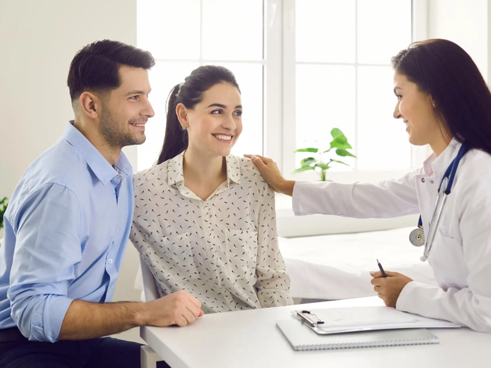 Female,Doctor,Consulting,Young,Couple,Patients,In,Fertility,Clinic,About