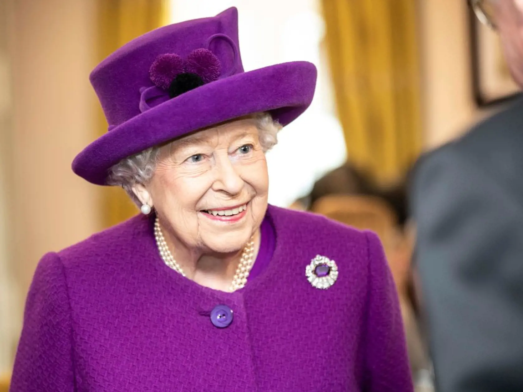 AYLESFORD, ENGLAND - NOVEMBER 06: Queen Elizabeth II talks with residents in the new Appleton Lodge care facility run by the RBLI during a visit to the Royal British Legion Industries village to celebrate the charity's centenary year on November 6, 2019 in Aylesford, England. (Photo by Richard Pohle - WPA Pool/Getty Images)