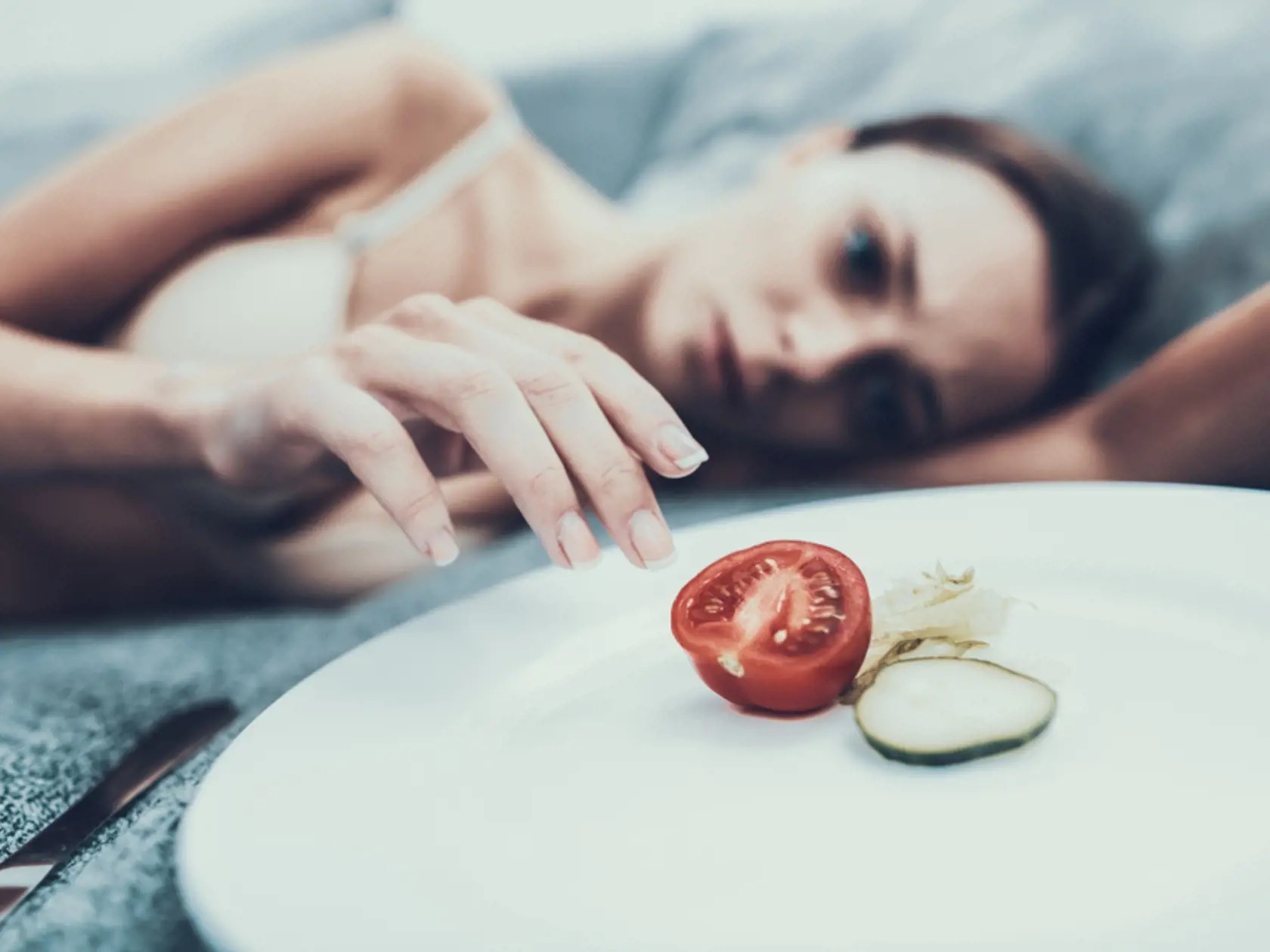Slim,Girl,With,Anorexia,Lying,On,Sofa,With,Plate.,Sliced