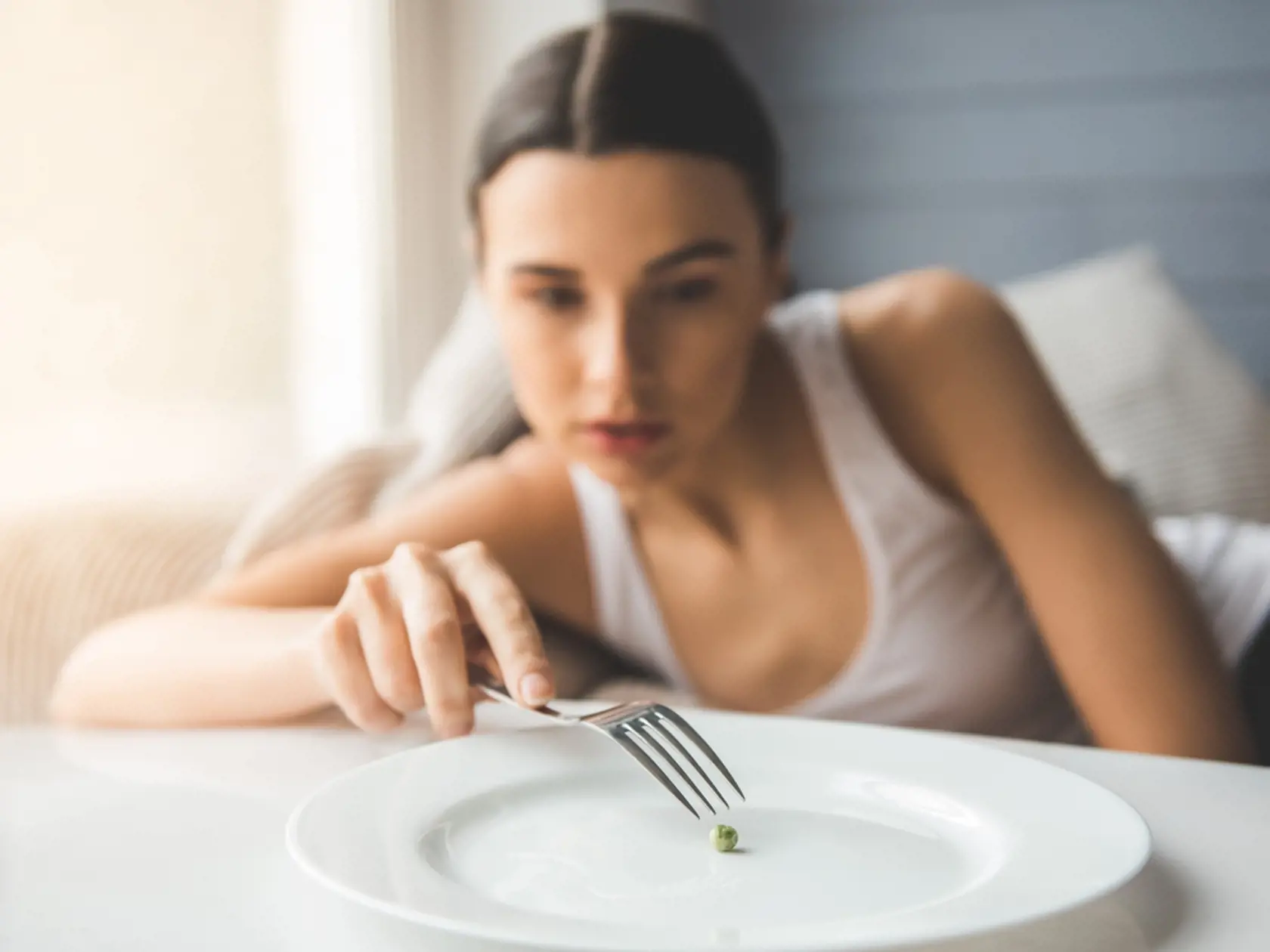 Suffering,From,Anorexia.,Girl,Is,Trying,To,Put,A,Pea