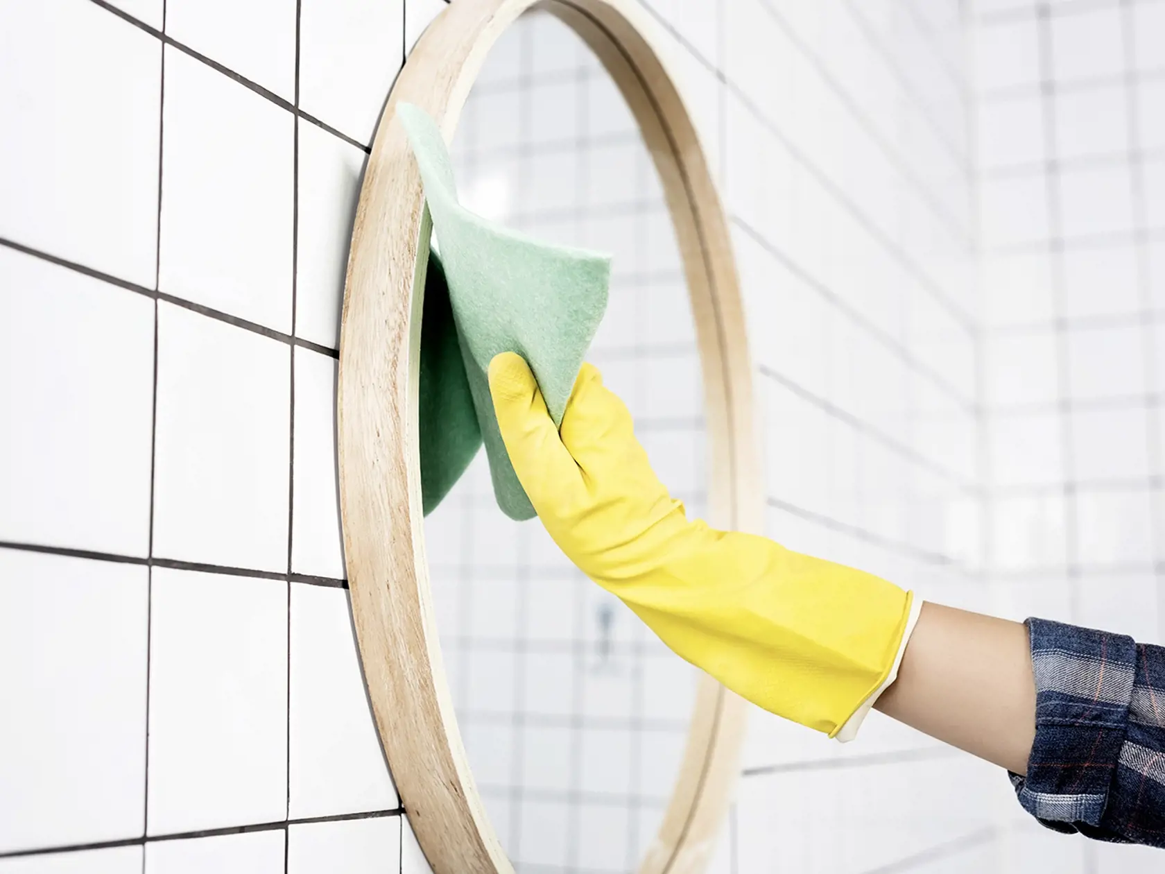 Cropped,View,Of,Woman,In,Rubber,Glove,Swiping,Mirror,With