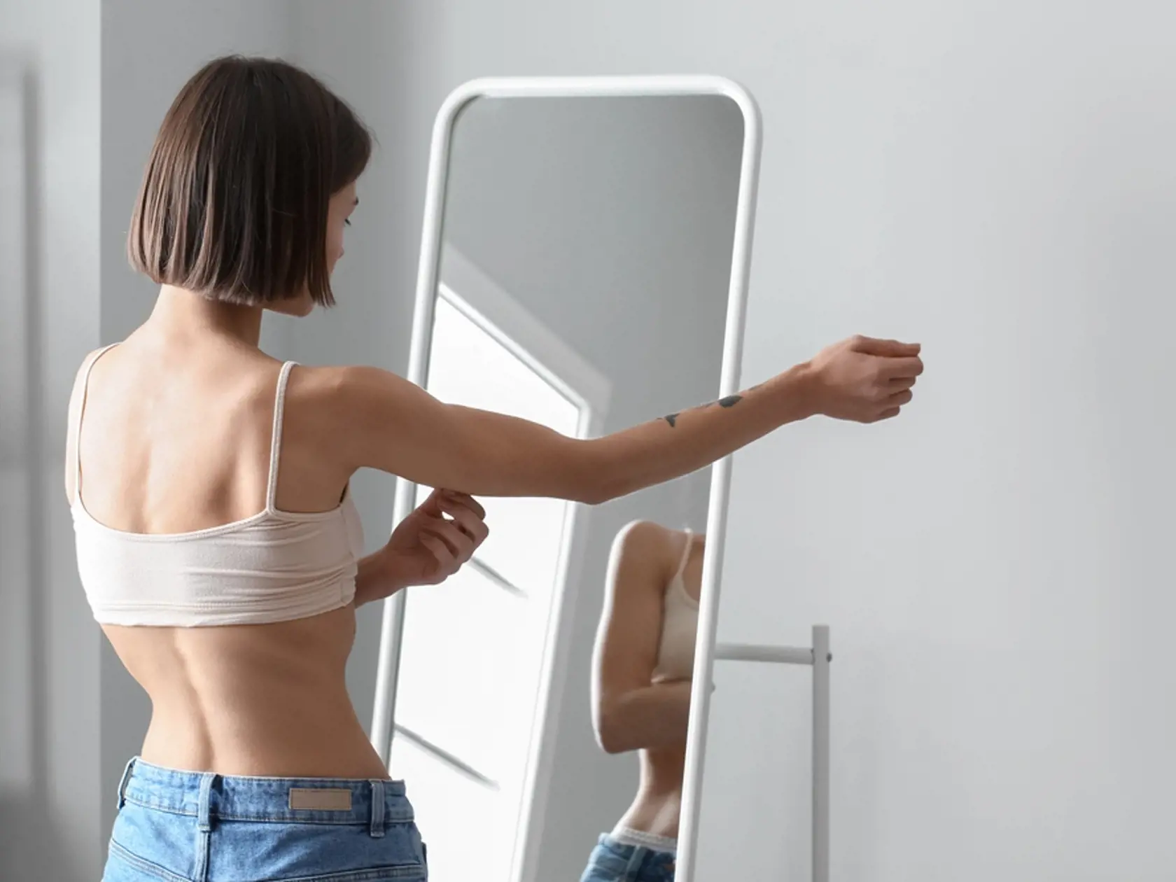 Young,Skinny,Woman,In,Front,Of,Mirror,At,Home.,Anorexia