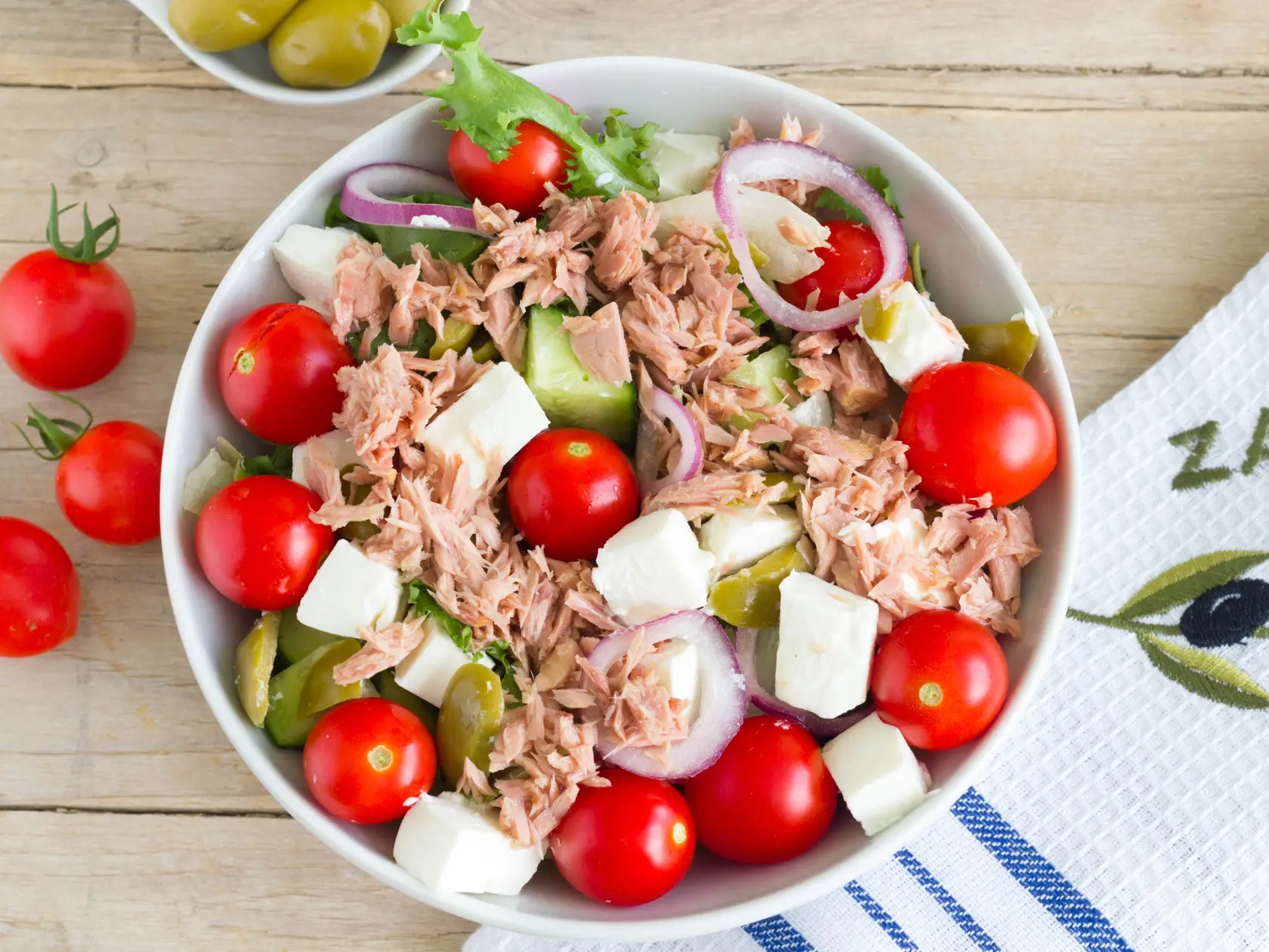 Greek,Salad,With,Tuna,Fish,On,A,Wooden,Table,,Up