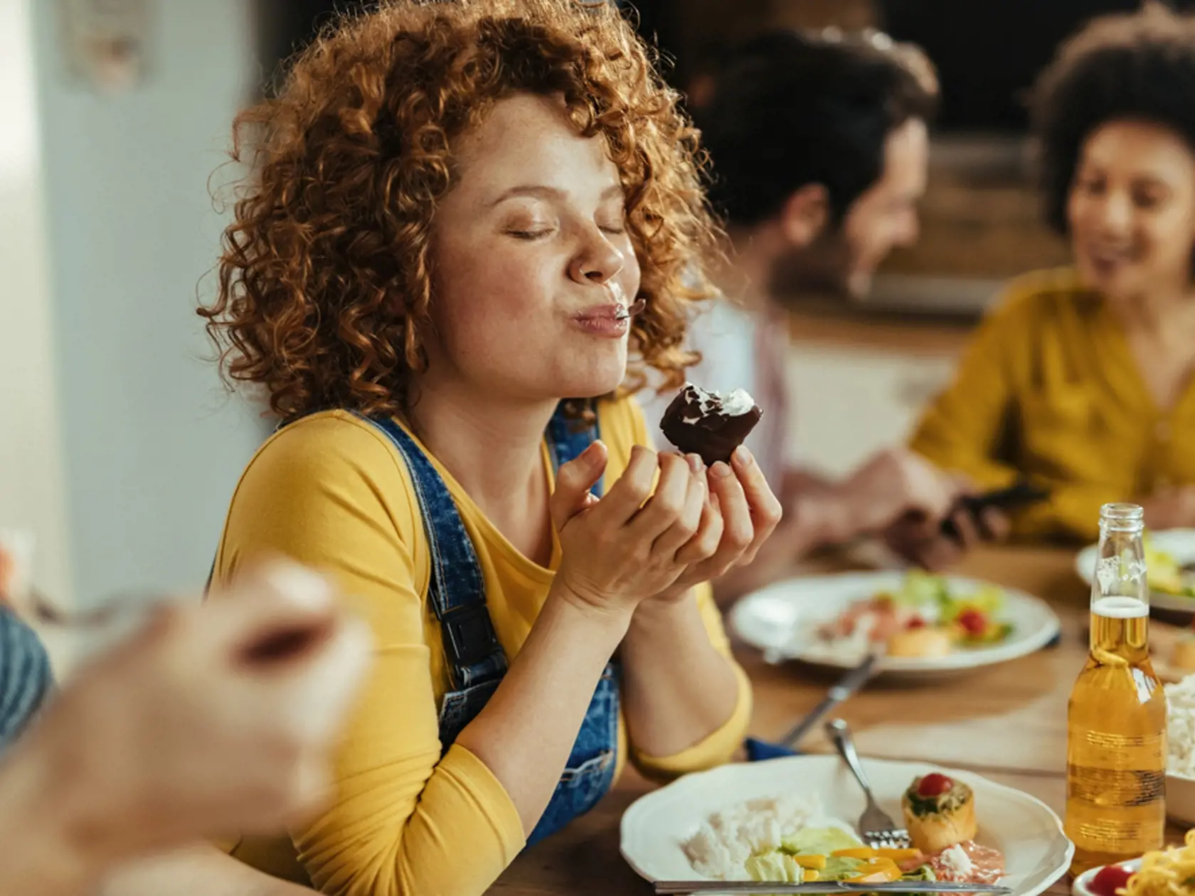 Young,Woman,With,Eyes,Closed,Enjoying,In,Taste,Of,Food