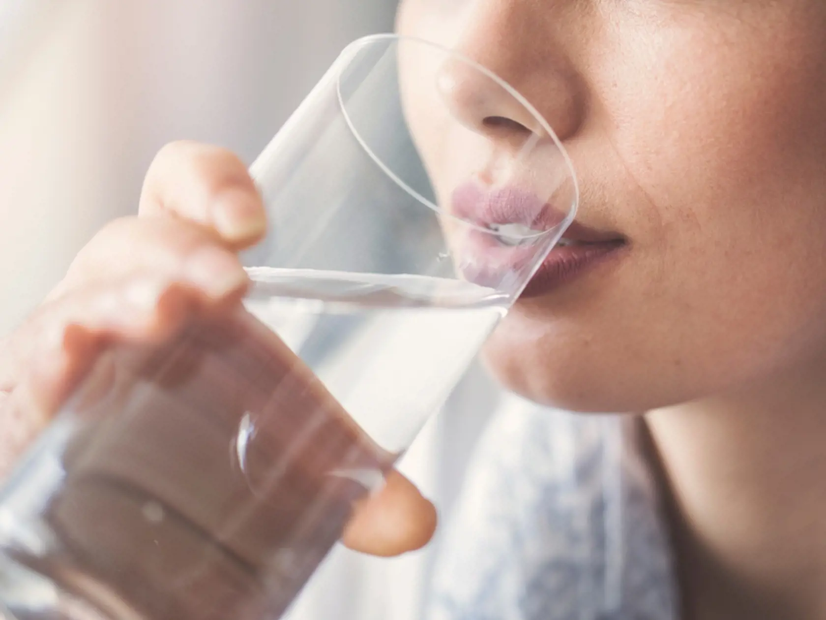 Young,Woman,Drinking,Pure,Glass,Of,Water