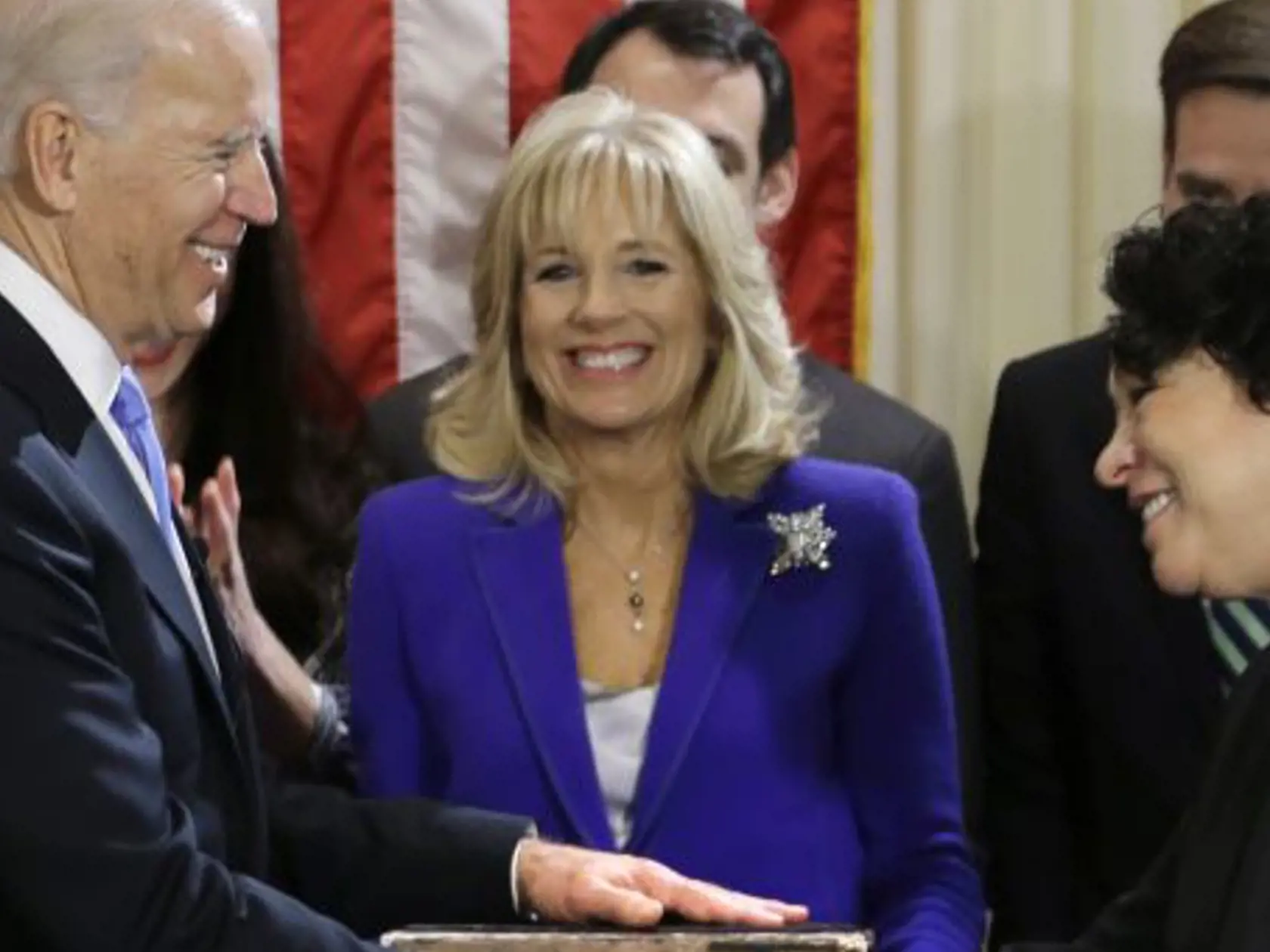 Vice President Joe Biden, with his wife Jill Biden, center, holding the Biden Family Bible, shakes hands with Supreme Court Justice Sonia Sotomayor after taking the oath of office during an official ceremony at the Naval Observatory, Sunday, Jan. 20, 2013, in Washington. (AP Photo/Carolyn Kaster)