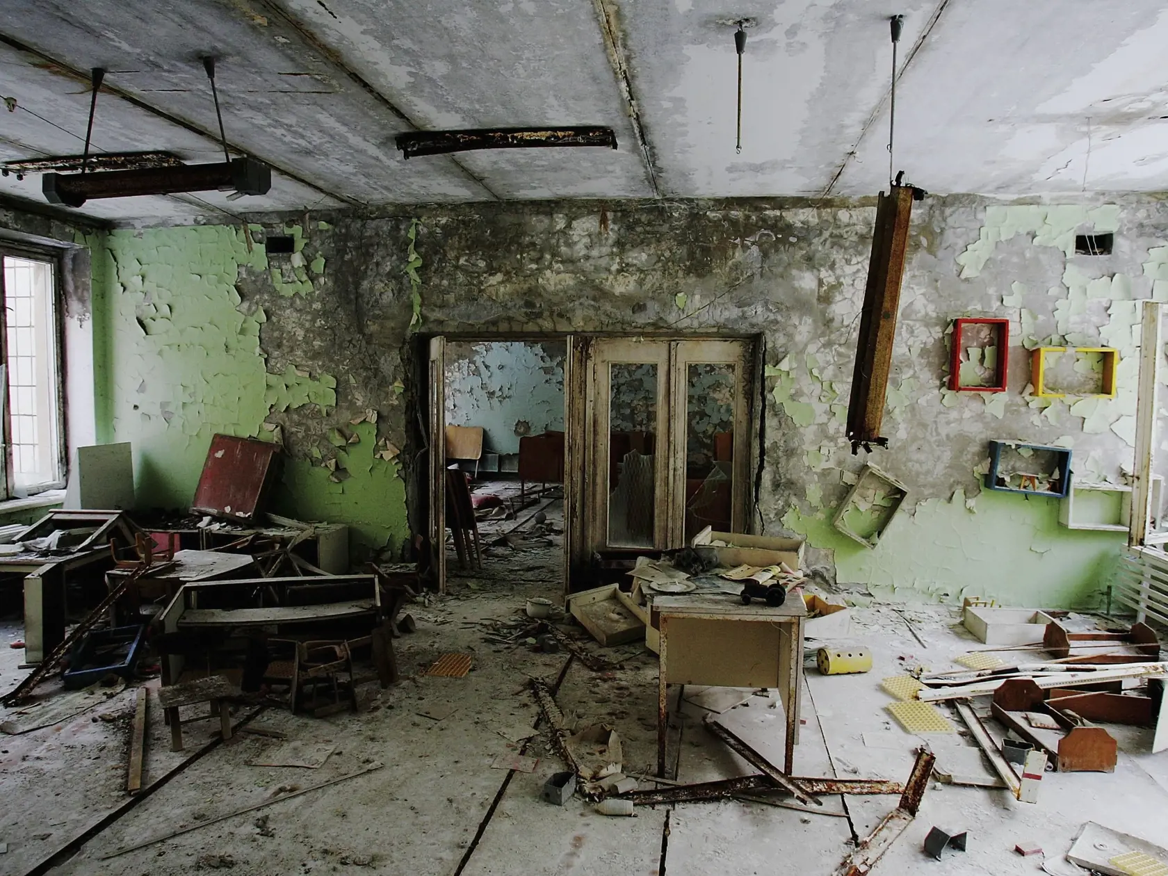 CHERNOBYL - JANUARY 25: The remnants of an abandoned class room is seen in a pre-school in the deserted town of Pripyat on January 25, 2006 in Chernobyl, Ukraine. Prypyat and the surrounding area will not be safe for human habitation for several centuries. Scientists estimate that the most dangerous radioactive elements will take up to 900 years to decay sufficiently to render the area safe.   (Photo by Daniel Berehulak/Getty Images)
