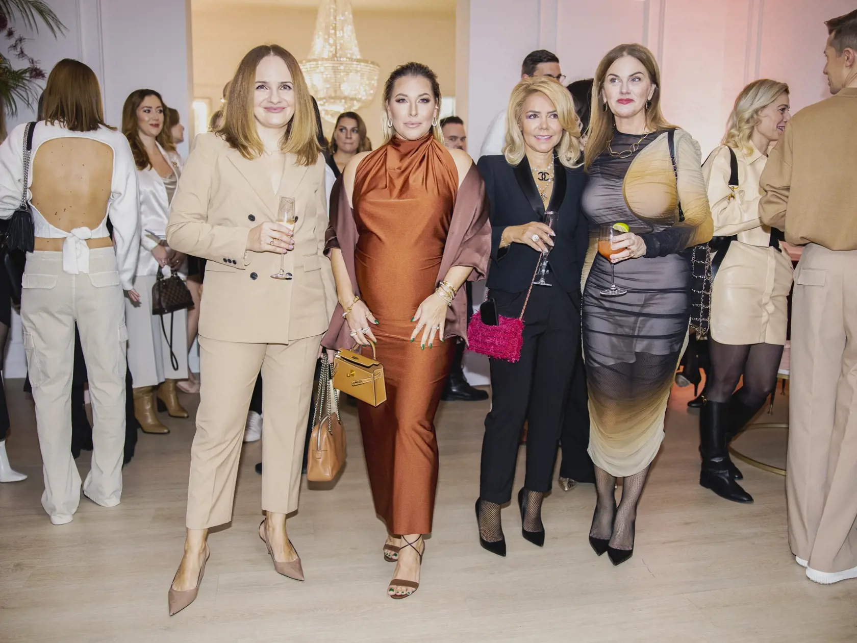 Na snímke Katarína Cibulková, Dominika Navara Cibulková, Monika Beňová a Zuzana Kubovčíková Šebová počas párty pri príležitosti piateho výročia založenia kliniky ENVY.