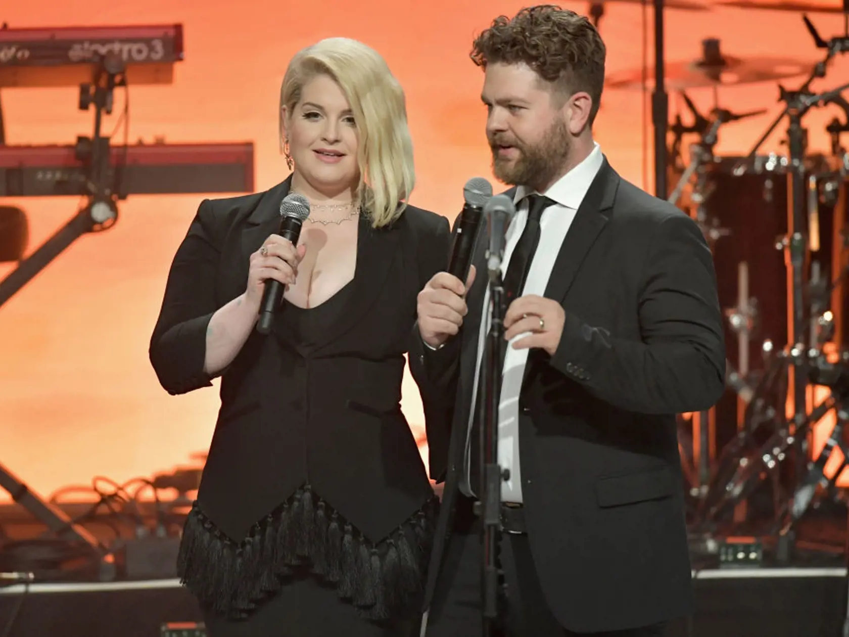 BEVERLY HILLS, CA - APRIL 20:  Kelly Osbourne and Jack Osbourne speak onstage at the 25th Annual Race To Erase MS Gala at The Beverly Hilton Hotel on April 20, 2018 in Beverly Hills, California.  (Photo by Neilson Barnard/Getty Images for Race To Erase MS )
