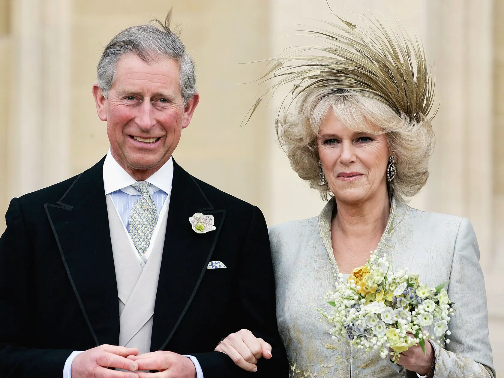 WINDSOR, ENGLAND - APRIL 9: HRH the Prince of Wales, Prince Charles, and The Duchess Of Cornwall, Camilla Parker Bowles in silk dress by Robinson Valentine and head-dress by Philip Treacy, leaves the Service of Prayer and Dedication blessing their marriage at Windsor Castle on April 9, 2005 in Berkshire, England. (Photo by Tim Graham Photo Library via Getty Images)  