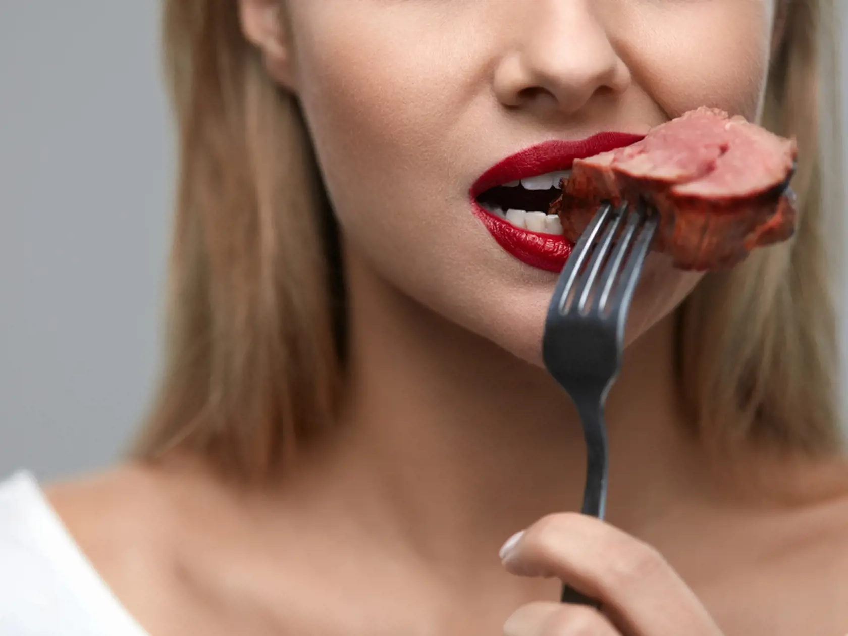 Woman,Eating,Meat.,Closeup,Of,Healthy,Hungry,Girl,With,Beautiful